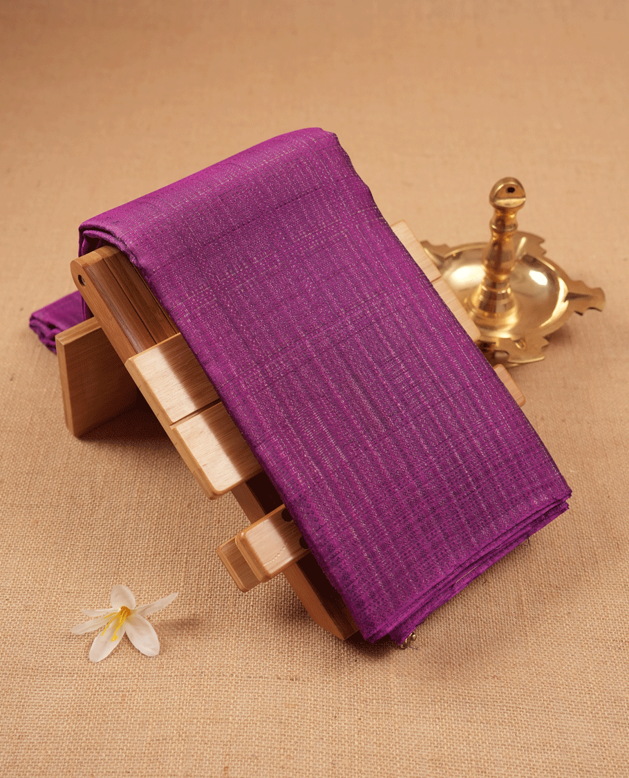 Violet coloured Manthrakodi saree featuring a multicoloured zari jacquard body, complemented by a self coloured turning Banarasi border and a matching self coloured blouse.