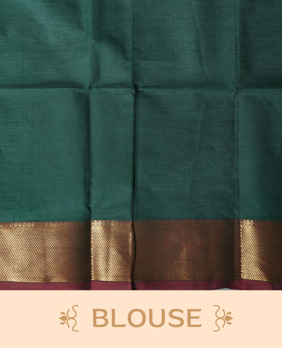 Dark green colour chettinad cotton saree featuring elegant plain body highlighting contrast maroon colour colour with gold zari traditional border, pallu and paired with matching blouse piece.