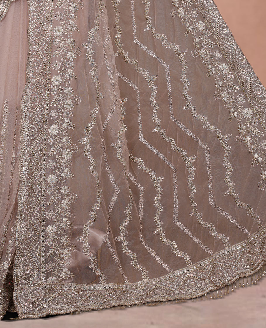 Beige Colour net designer Wedding saree featuring all over floral embroidery with sequin detailing and an ornate scalloped border, finished with a matching embellished blouse.