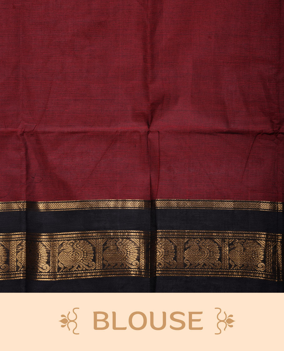 Dark red colour chettinad cotton saree featuring plain body, paired with a black colour traditional gold zari border paired with matching blouse.