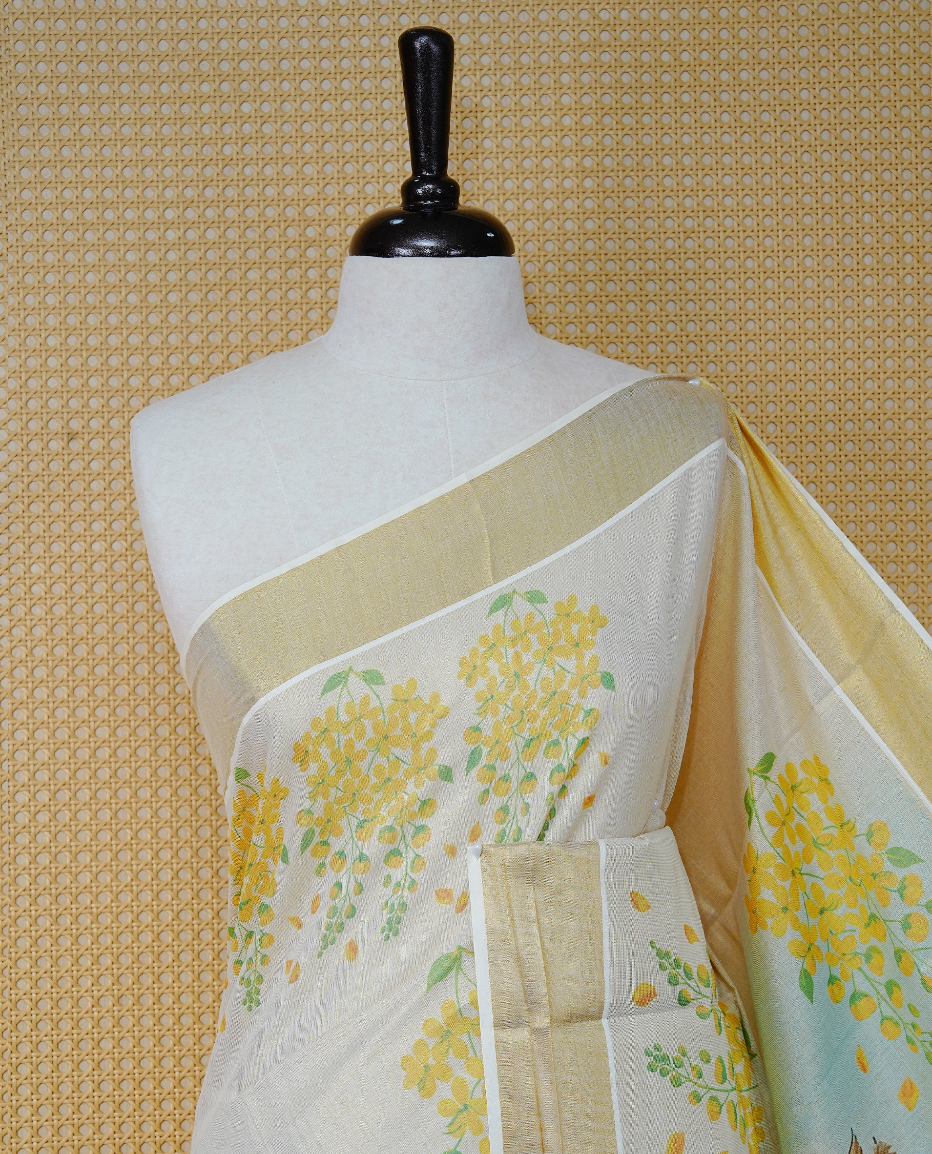 Cream Colour Tissue Kerala Saree Featuring Vibrant Digital Krishna & Radha Onam Theme Printed Pallu, Beautifully Enhanced With A Classic Gold Zari Border And Contrast Tassels. Paired With A Matching Blouse Piece.