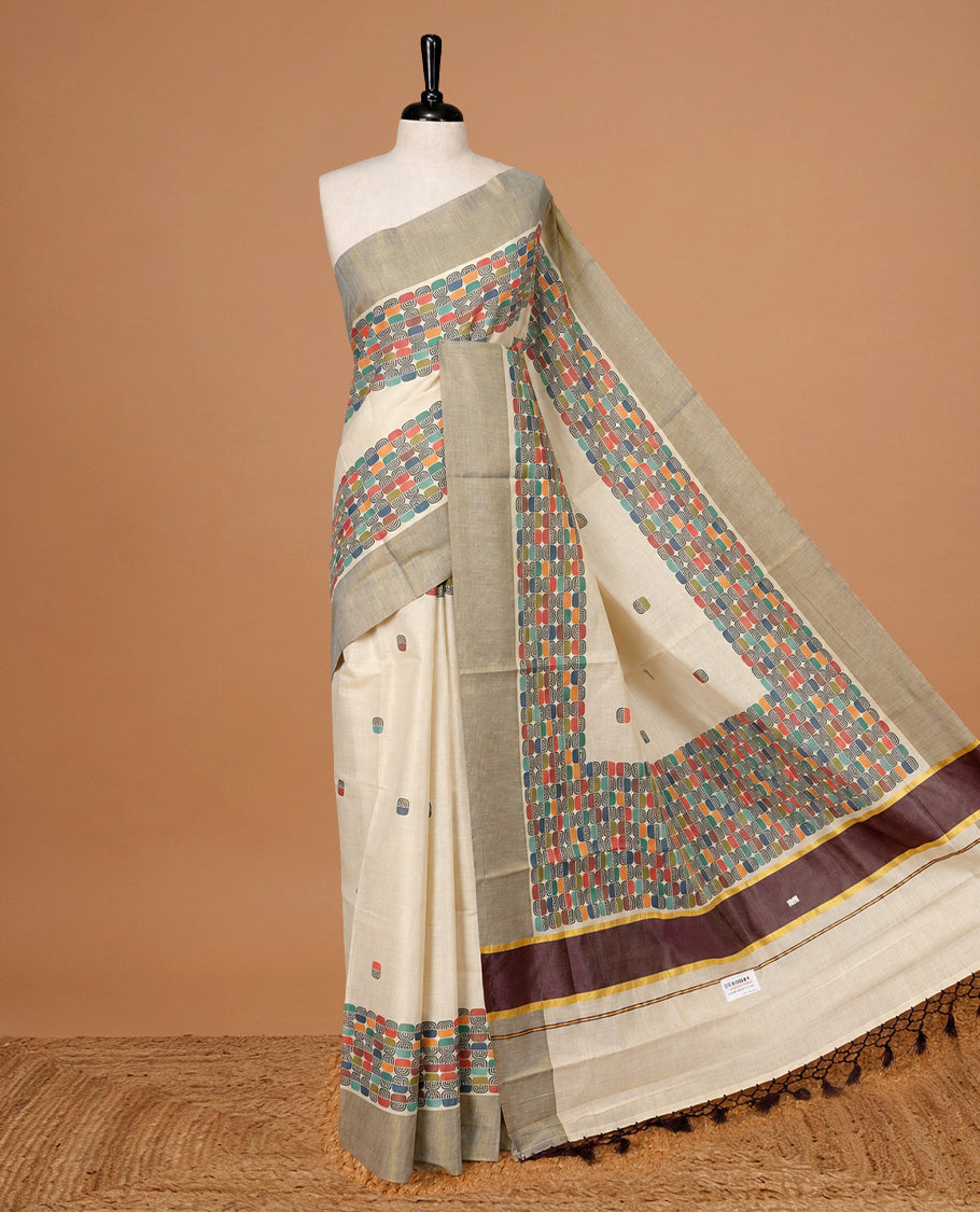 Cream colour Tissue kerala saree featuring Classy Multi colour Box pattern on body, Styled by Burgundy & gold zari border and pallu, comes with matching blouse piece.