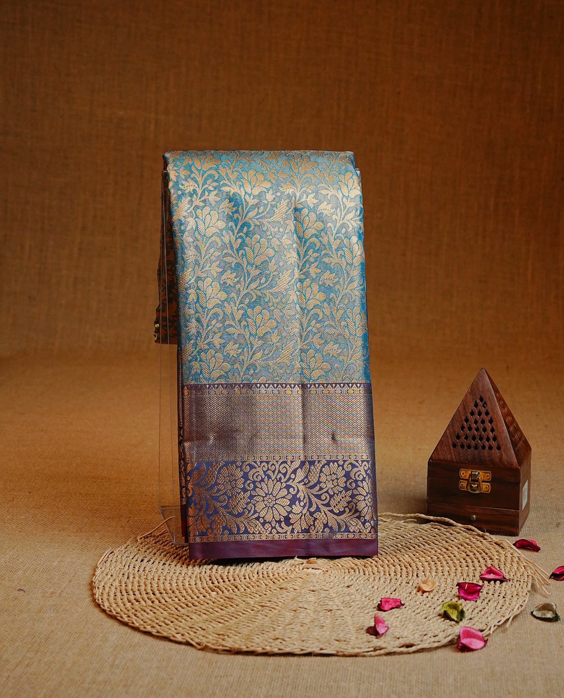 Blue colour Double shade Semi tissue silk saree featuring Gold zari Kodi pattern on body, Contrast Purple colour with traditional border, paired with matching.