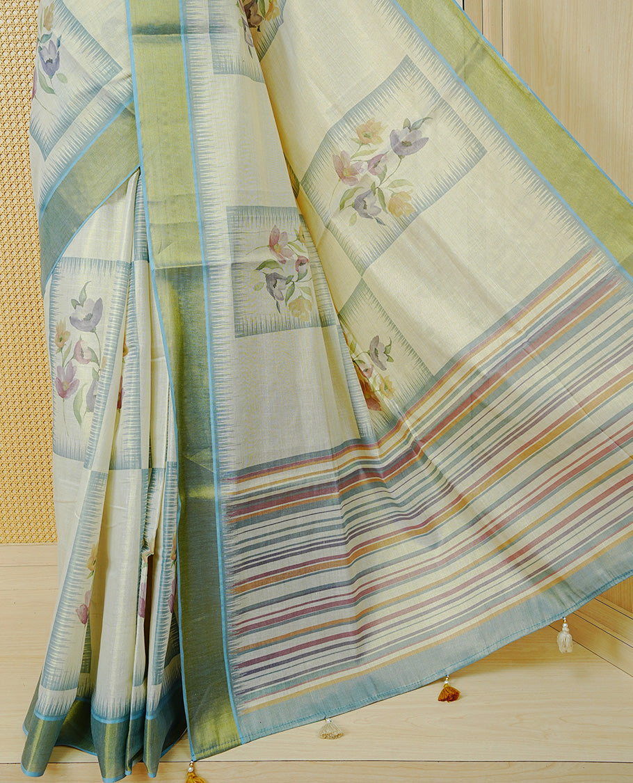 Cream Colour Tissue Kerala Saree Featuring Floral Prints in a Stylish Rectangle Pattern On Body, Enhanced with an Olive Green and Light Blue Zari Border, Multicoloured Striped Pallu Is Finished with Elegant Tassels and Paired with a Matching Blouse Piece.