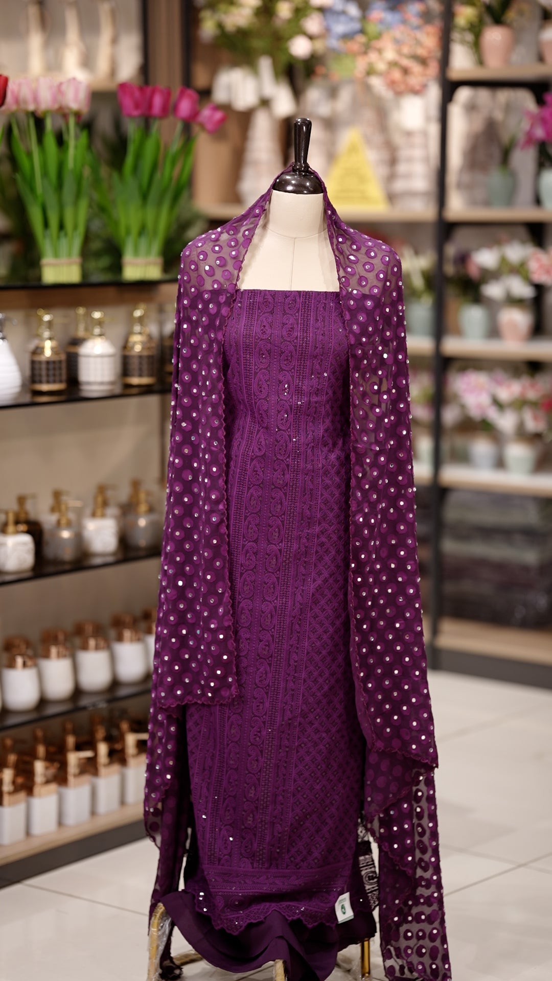 Purple colour Chiffon salwar material featuring elegant chikankari with sequins work on the top, paired with a beautifully mirror worked dupatta and a matching bottom piece for a graceful look.