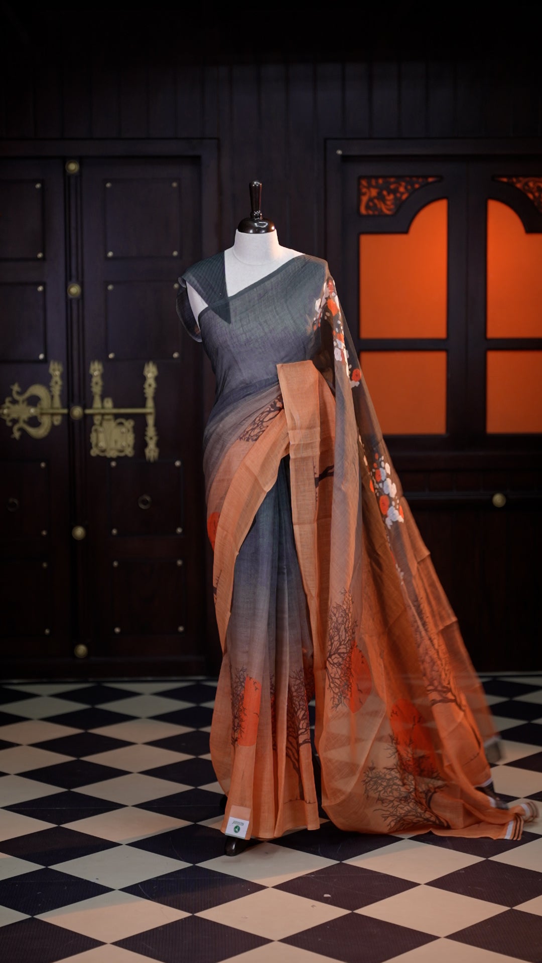 Orange colour Semi Jute Texture saree with the beauty of digital print ombre effect on body, comes with a matching modern striped blouse.