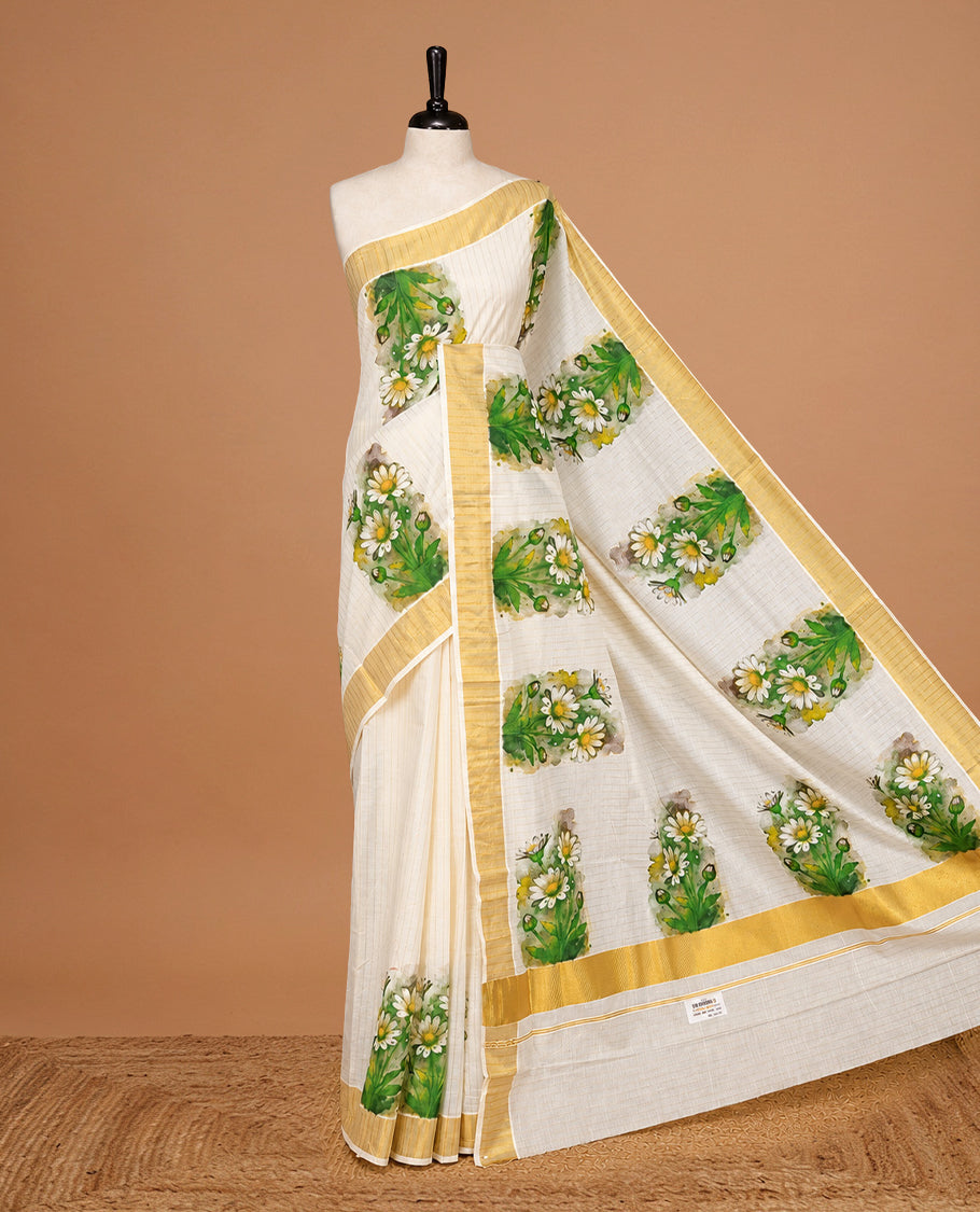 Cream Color Kerala Saree Featuring Gold Zari Stiprs On Body, Enrich Gold Zari With Floral Printed Border & Pallu, Paired With Matching Blouse Piece.