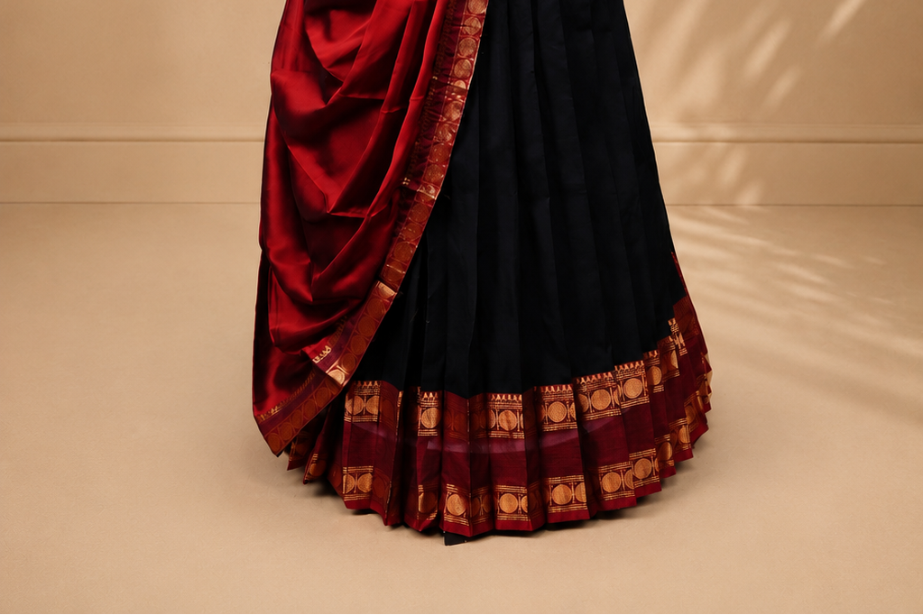 Black colour Half saree featuring Plain skirt with Zari border on contrast Red colour border, Unstitched Blouse and matching dupatta.