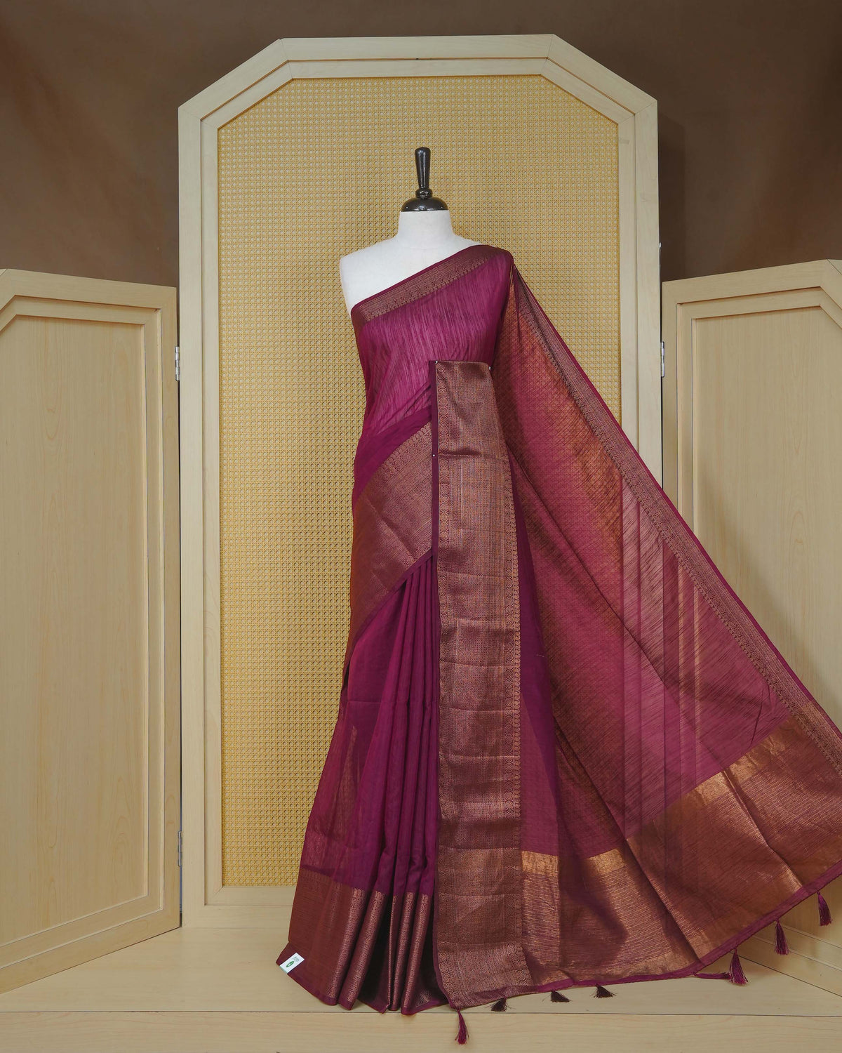 Wine colour semi linen saree plain body, contrast self colour gold zari detailed border, grand pallu comes with matching blouse piece