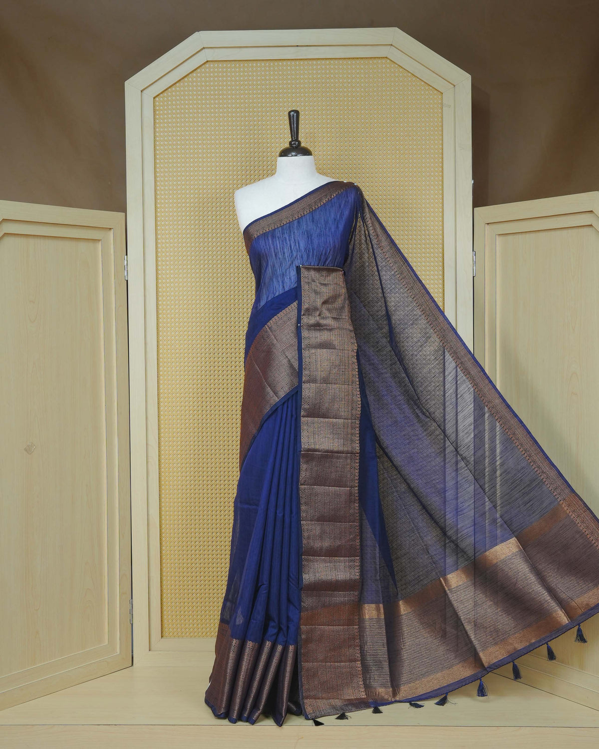 Dark navy blue colour semi linen saree plain body, contrast self colour gold zari detailed border, grand pallu comes with matching blouse piece