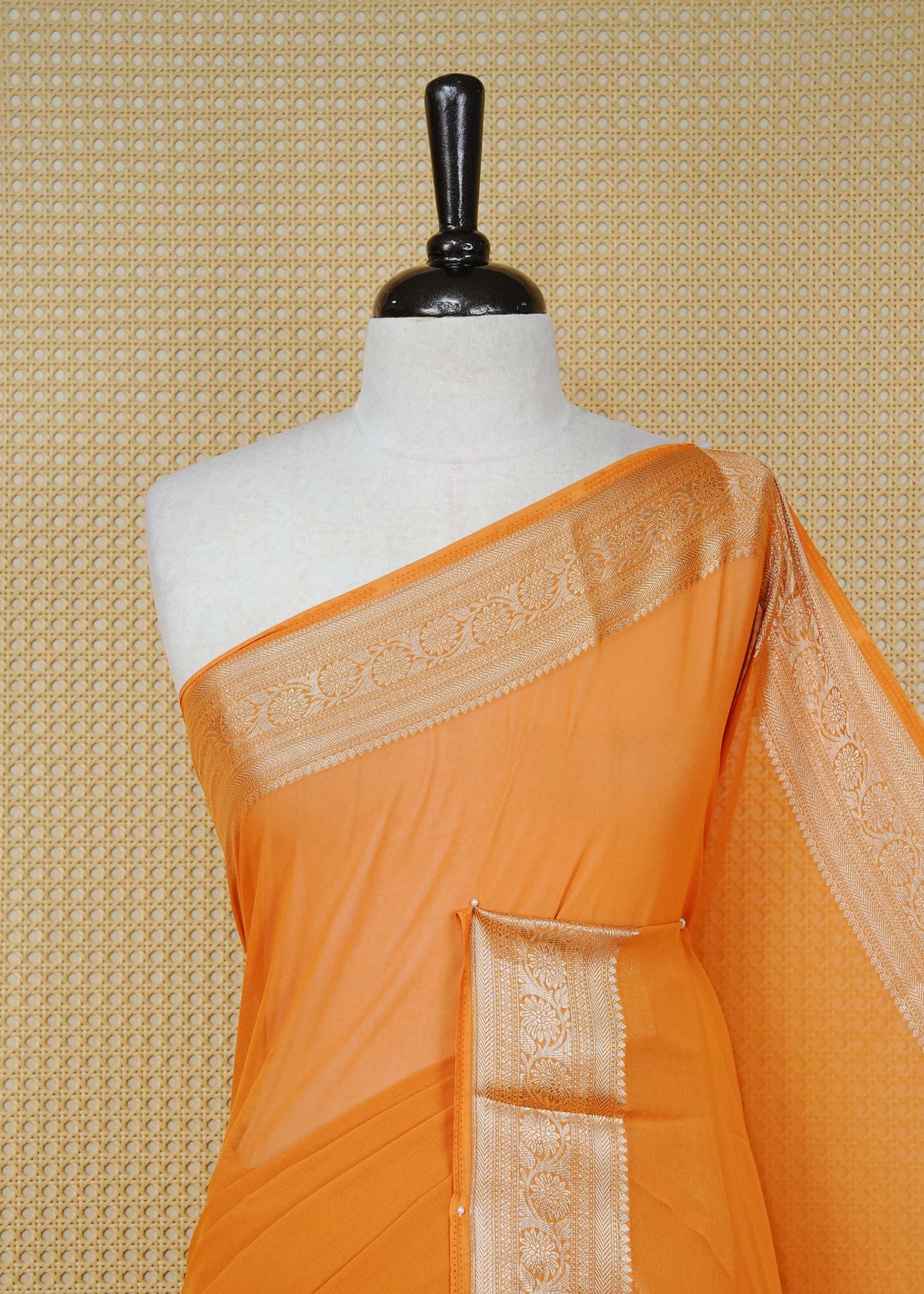 Orange colour georgette saree having plain boy, Floral Gold zari detailed pattern border, comes with matching blouse piece