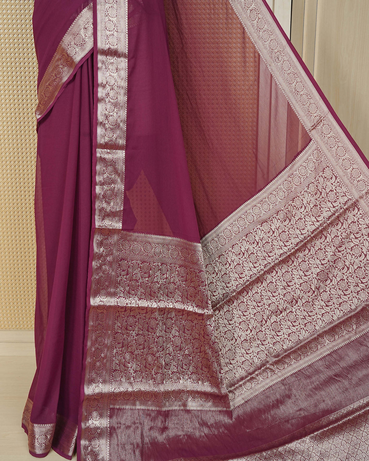 Wine colour georgette saree having plain boy, Floral Gold zari detailed pattern border, comes with matching blouse piece