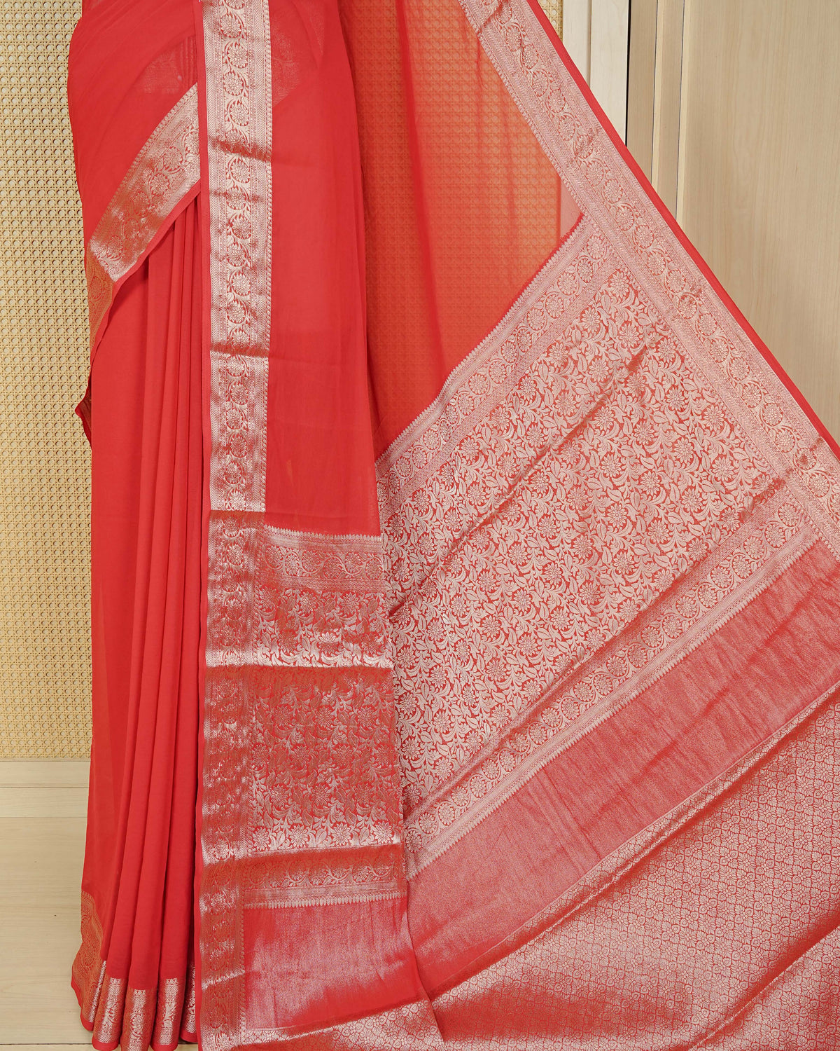 Vibrant red colour georgette saree having plain boy, Floral Gold zari detailed pattern border, comes with matching blouse piece