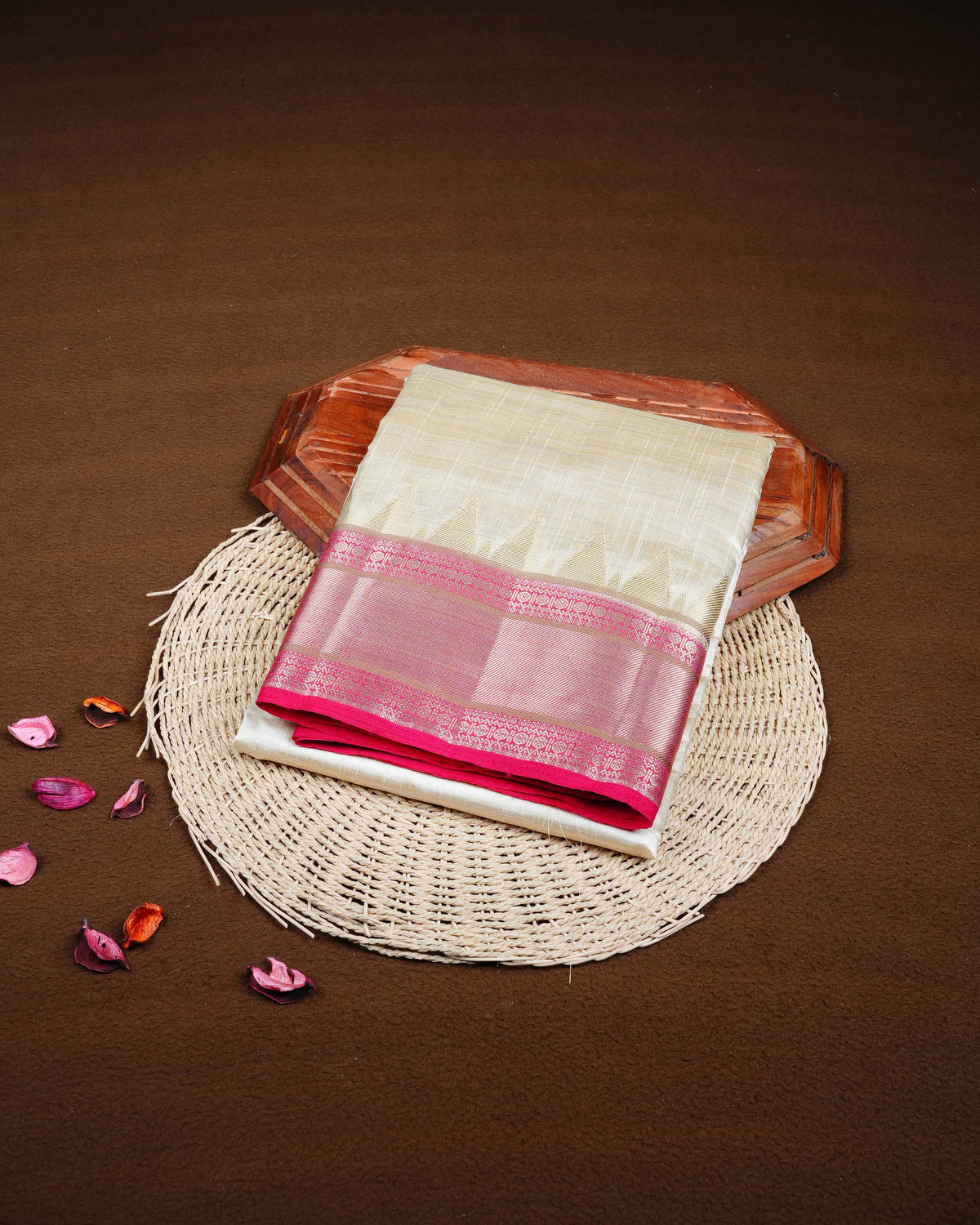 Cream colour Tussar silk saree Featuring Plain body, complemented by Contrast pink colour gold zari temple & zari border, paired with matching blouse piece.