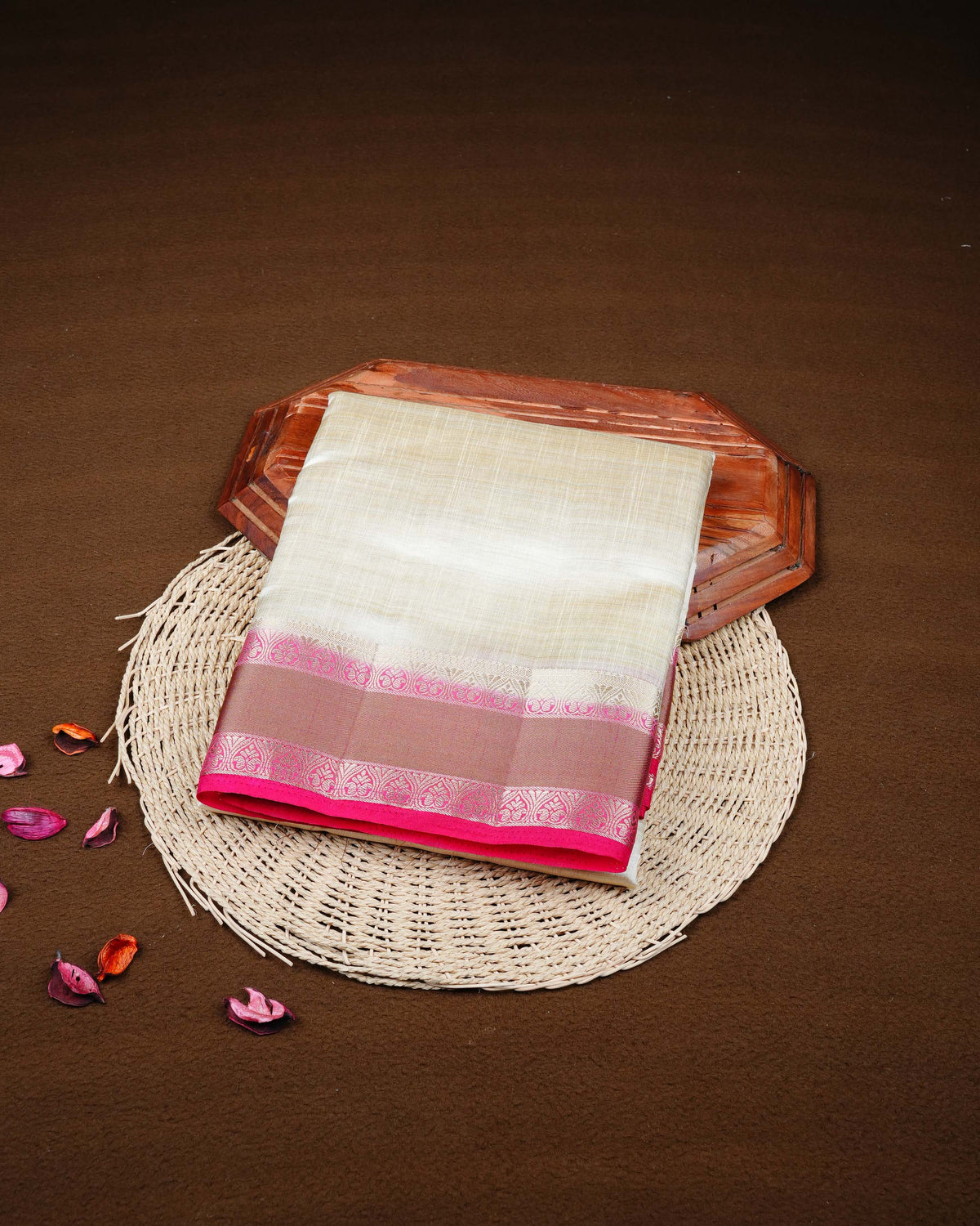Cream colour Tussar silk saree Featuring Plain body, complemented by Contrast pink colour double border with zari detailing, paired with matching blouse piece.