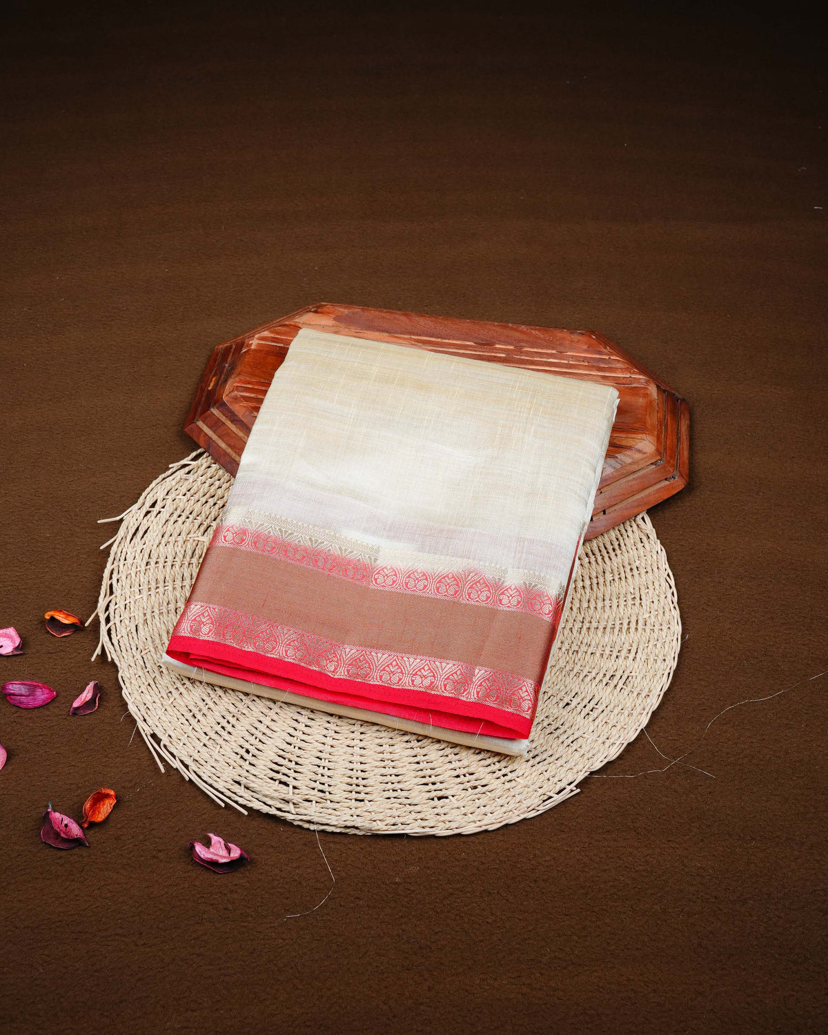 Cream colour Tussar silk saree Featuring Plain body, complemented by Contrast red colour double border with zari detailing, paired with matching blouse piece.