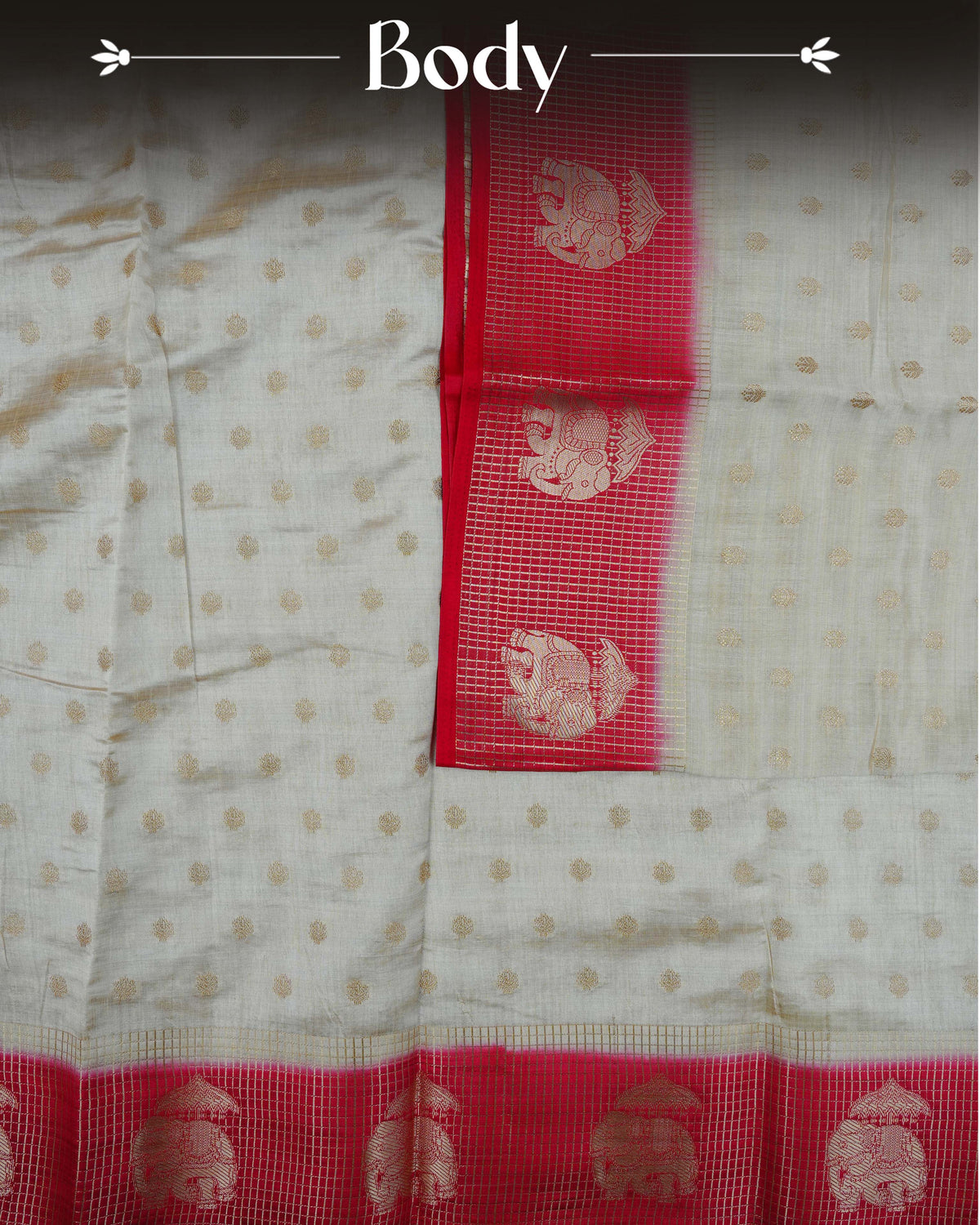 Cream colour Tussar silk saree Featuring buttas on body, complemented by Contrast red colour gold zari check pattern with elephant motifs on border, paired with matching blouse piece.