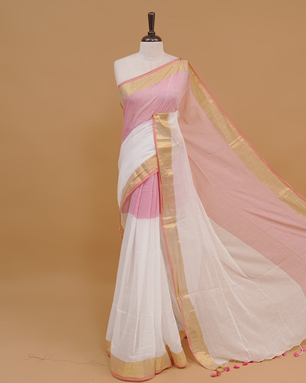 White Colour Mul Cotton Saree Featuring Plain body. With Contrast Gold and Blue Border, pallu comes With Blue Tassels