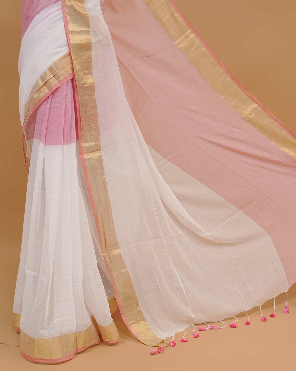 White Colour Mul Cotton Saree Featuring Plain body. With Contrast Gold and Blue Border, pallu comes With Blue Tassels
