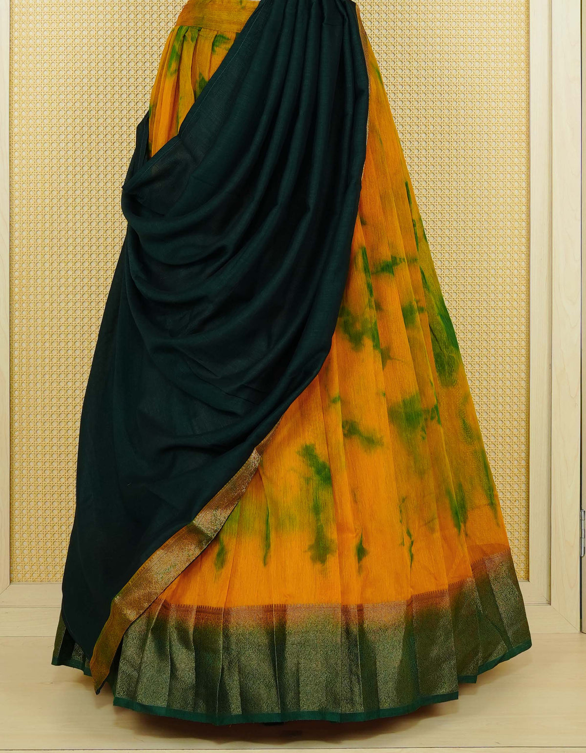 Mustard colour semi linen Semi Stitched dhavani set Featuring Green Colour Ombre shaded Body & contrast Green Colour Border with Gold zari Details on skirt, Contrast Blouse piece & matching dupatta.
