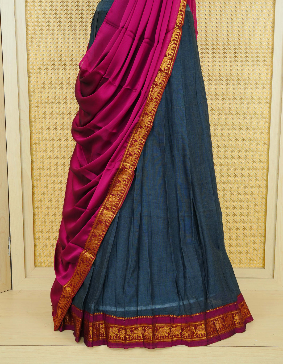 Dark Grey colour Chettinad Semi Stitched dhavani set Featuring contrast Magenta colour with Gold zari border on skirt, Contrast Blouse piece & matching dupatta.