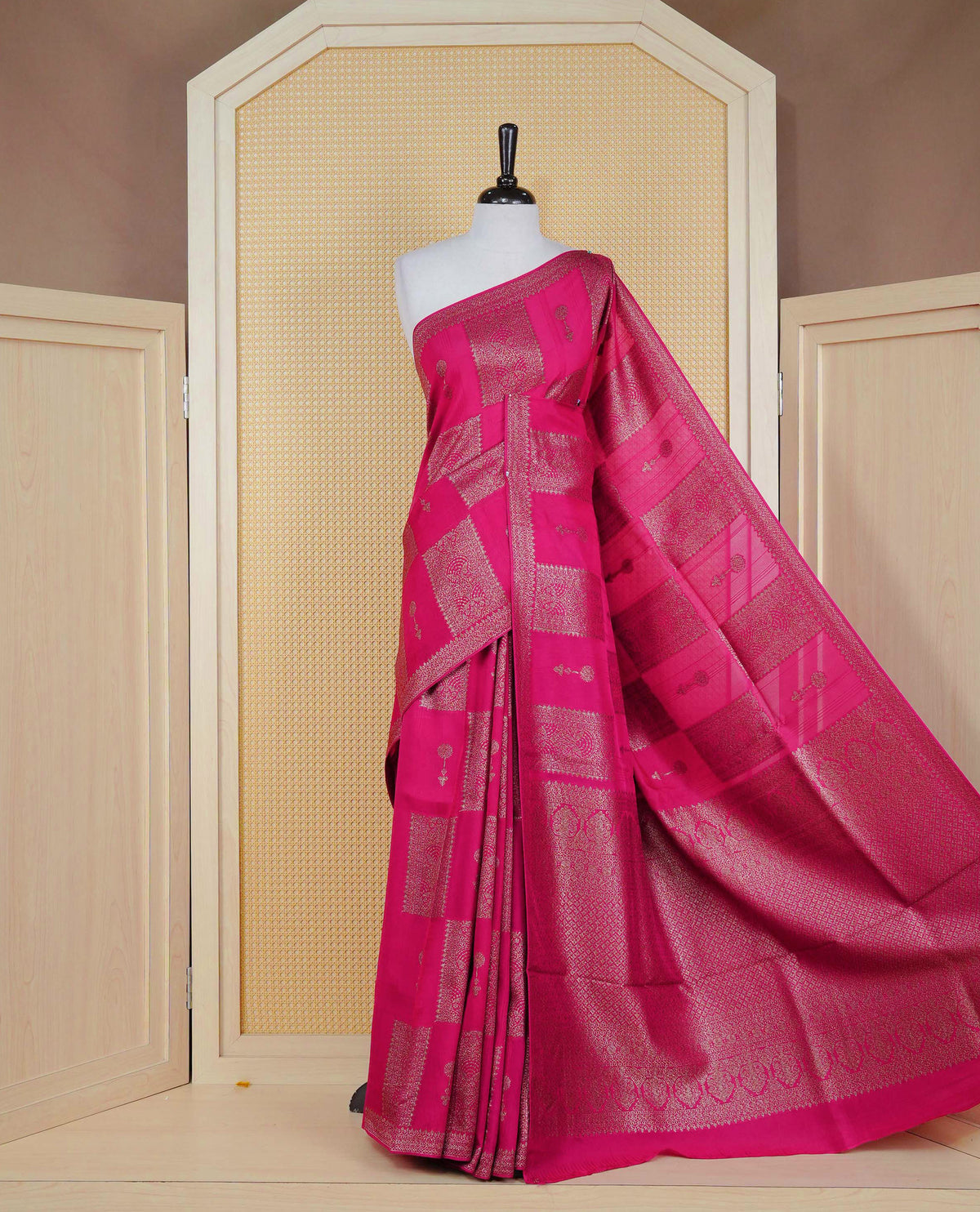Pink colour semi banaras tussar georgette saree featuring gold zari box pattern with motifs on body, finished with gold zari fancy border and paired with matching blouse piece.