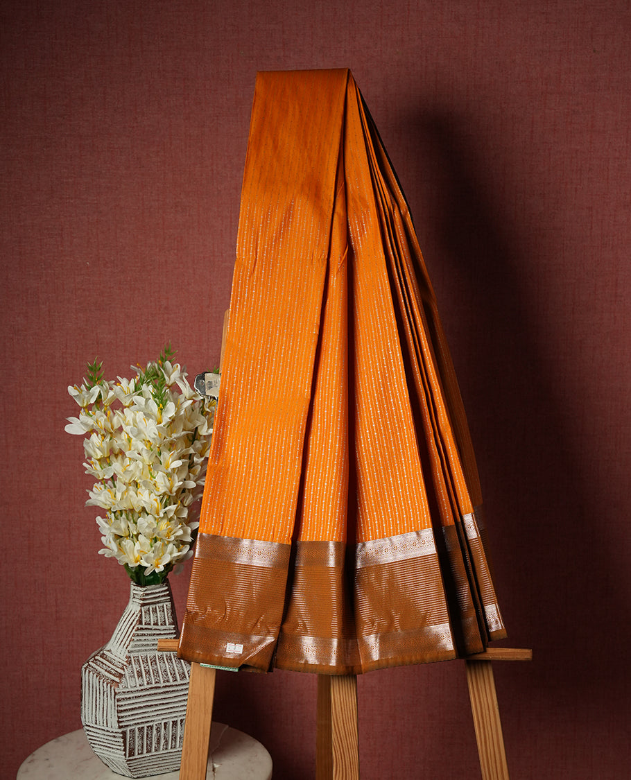 Saffron Orange Colour Semi Silk Saree with Golden Striped Body, Copper Zari Allover Heart Motif Pallu & Border, Textured Finish, and Matching Blouse Piece