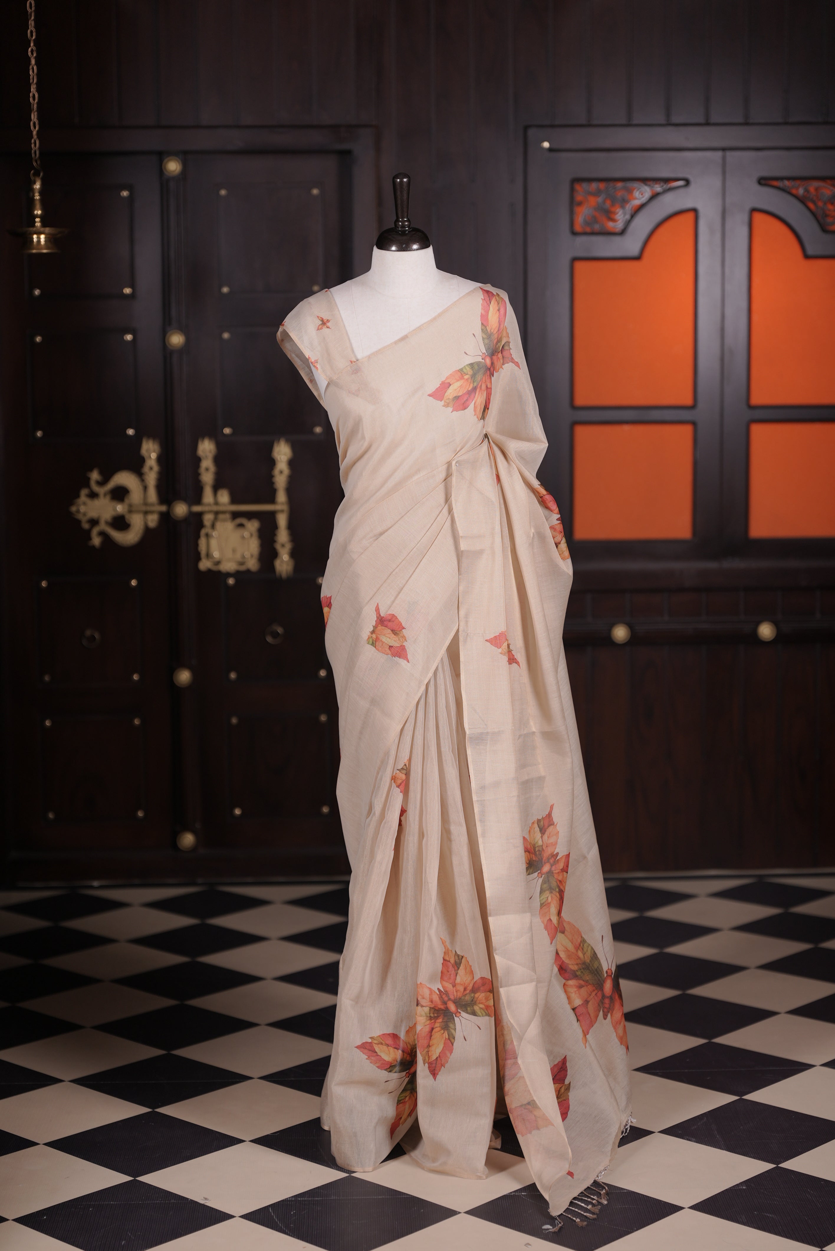 Beige colour semi linen tissue saree featuring multicolour butterfly digital print throughout body, pallu and small butterfly printed blouse piece.