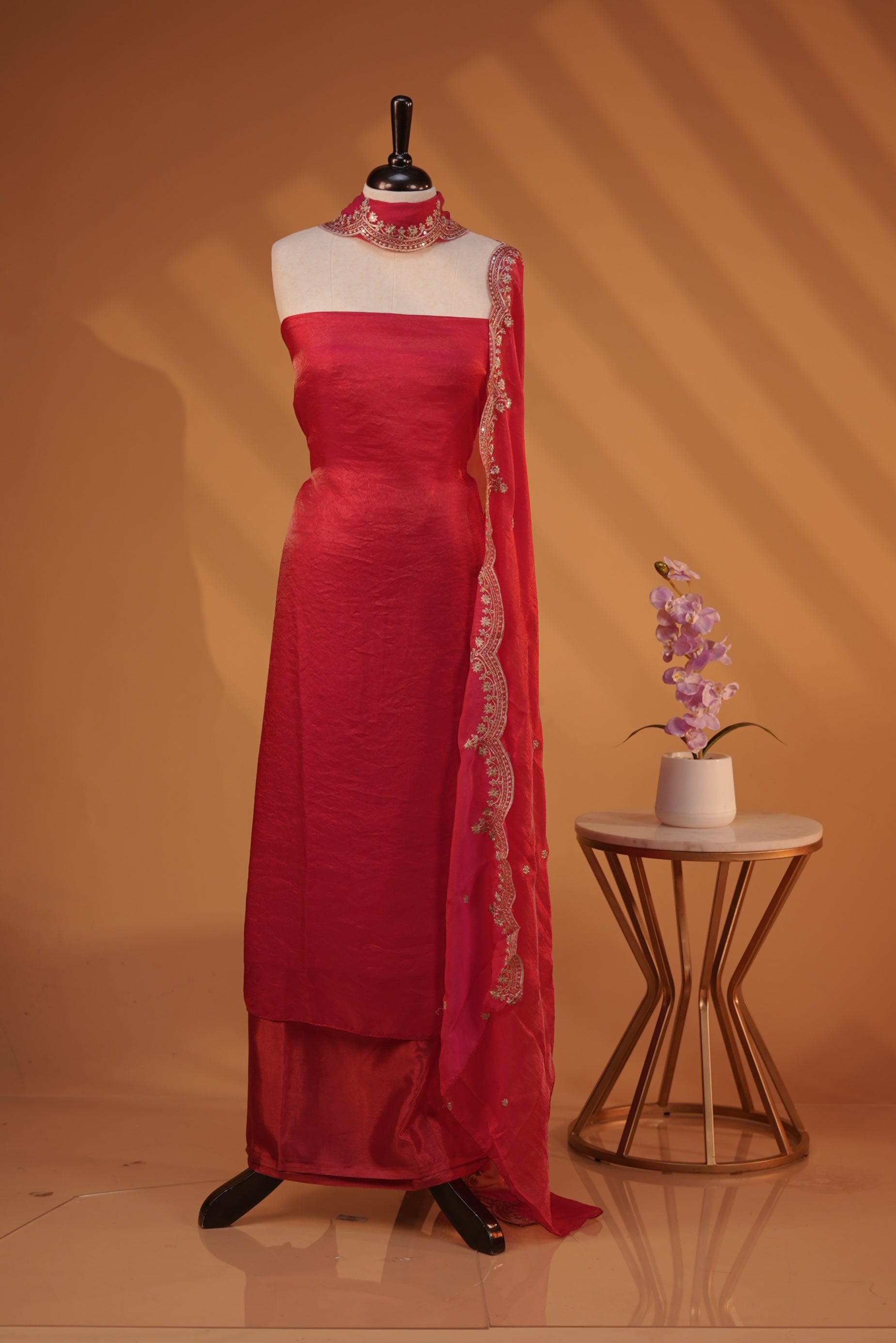 Rani Pink colour Fendy silk salwar material With Elegant plain body with lining, Comes with santoon bottom, Fendy silk dupatta With Floral buttas & Scalp Border.