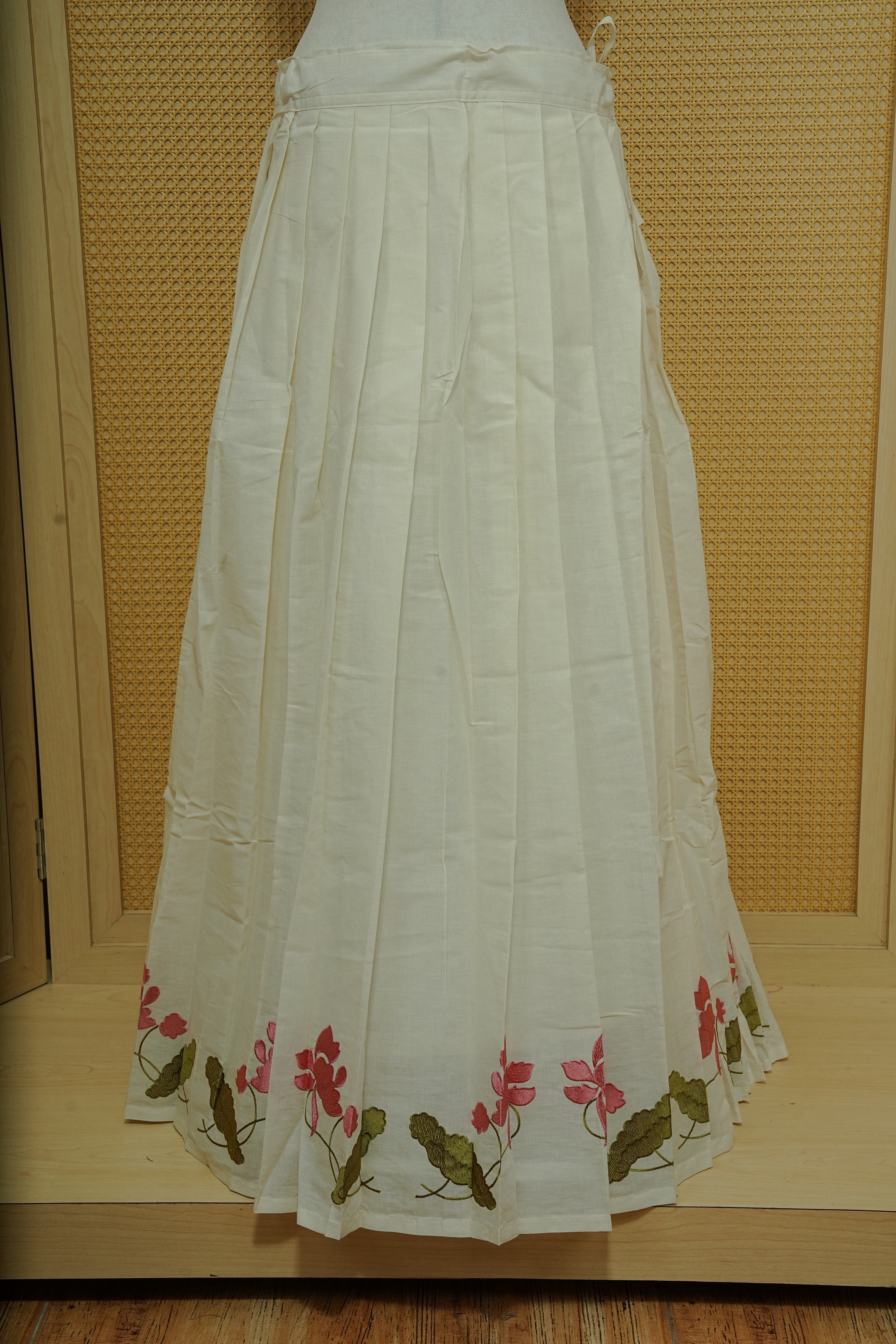Cream colour cotton Stitched Skirt With Pink colour floral & Leaf kodi thread pattern border.