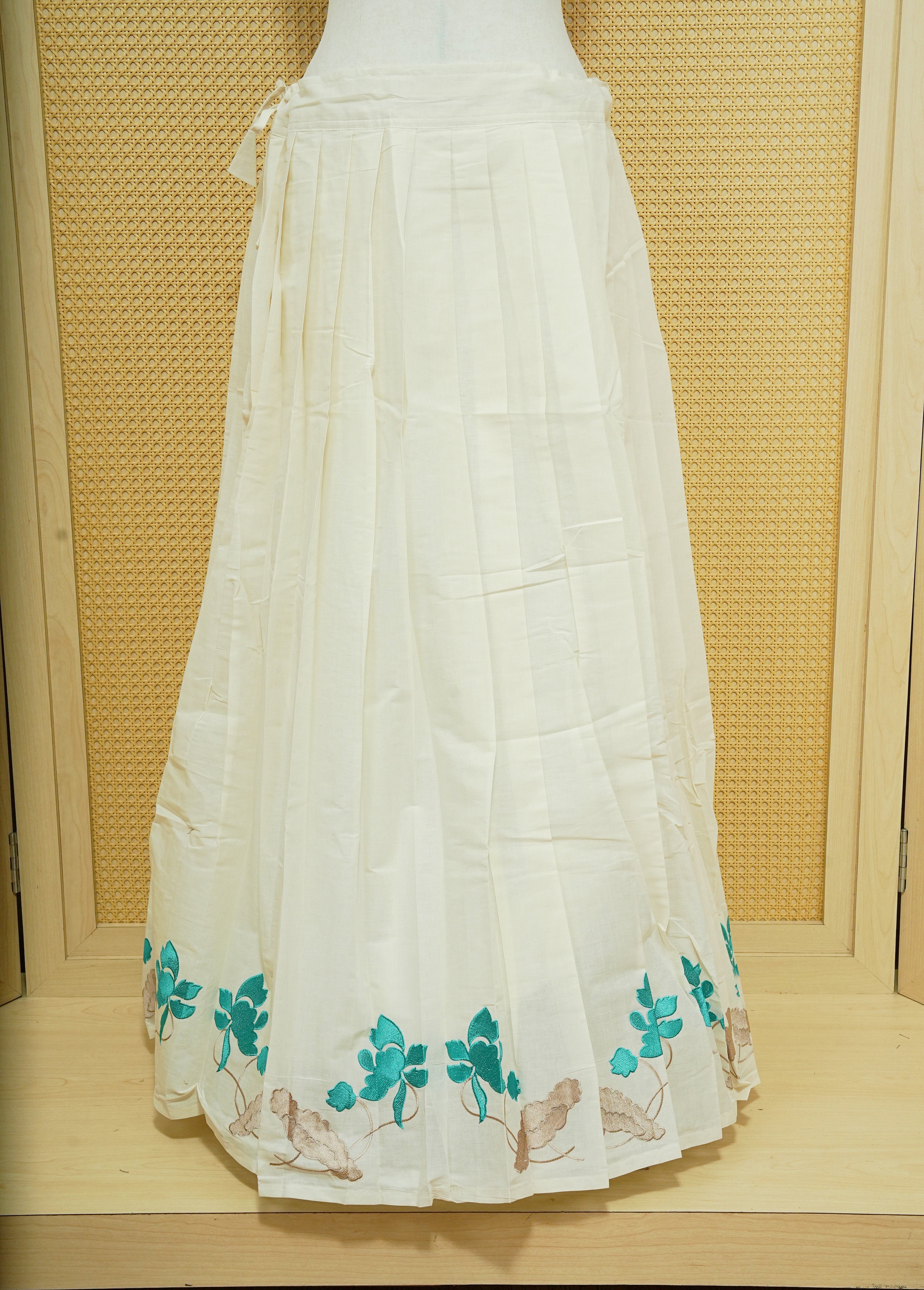Cream colour cotton Stitched Skirt With Aqua colour floral & Leaf kodi thread pattern border.