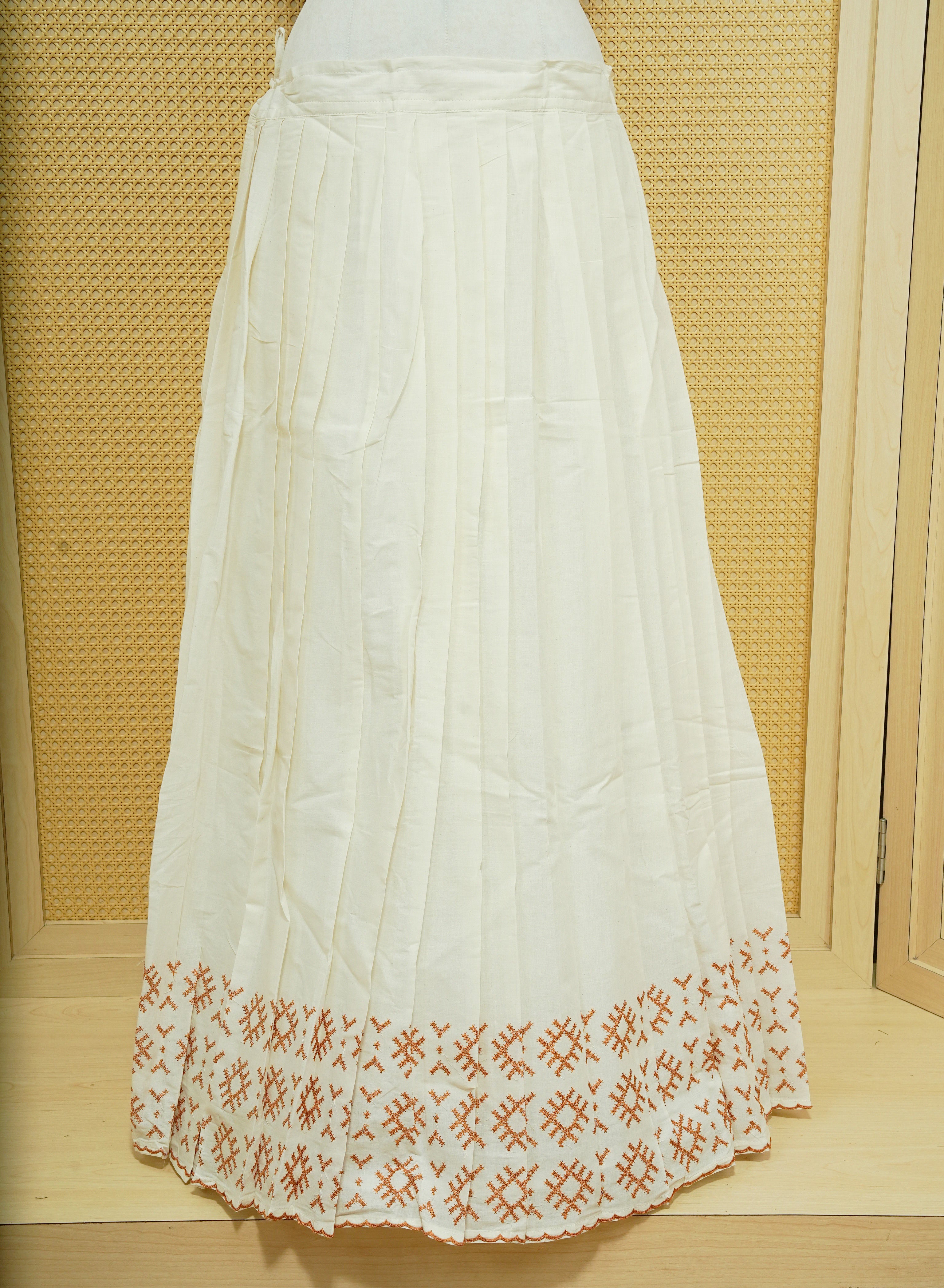 Cream colour cotton Stitched Skirt With Mustard colour thread pattern Scallop border.