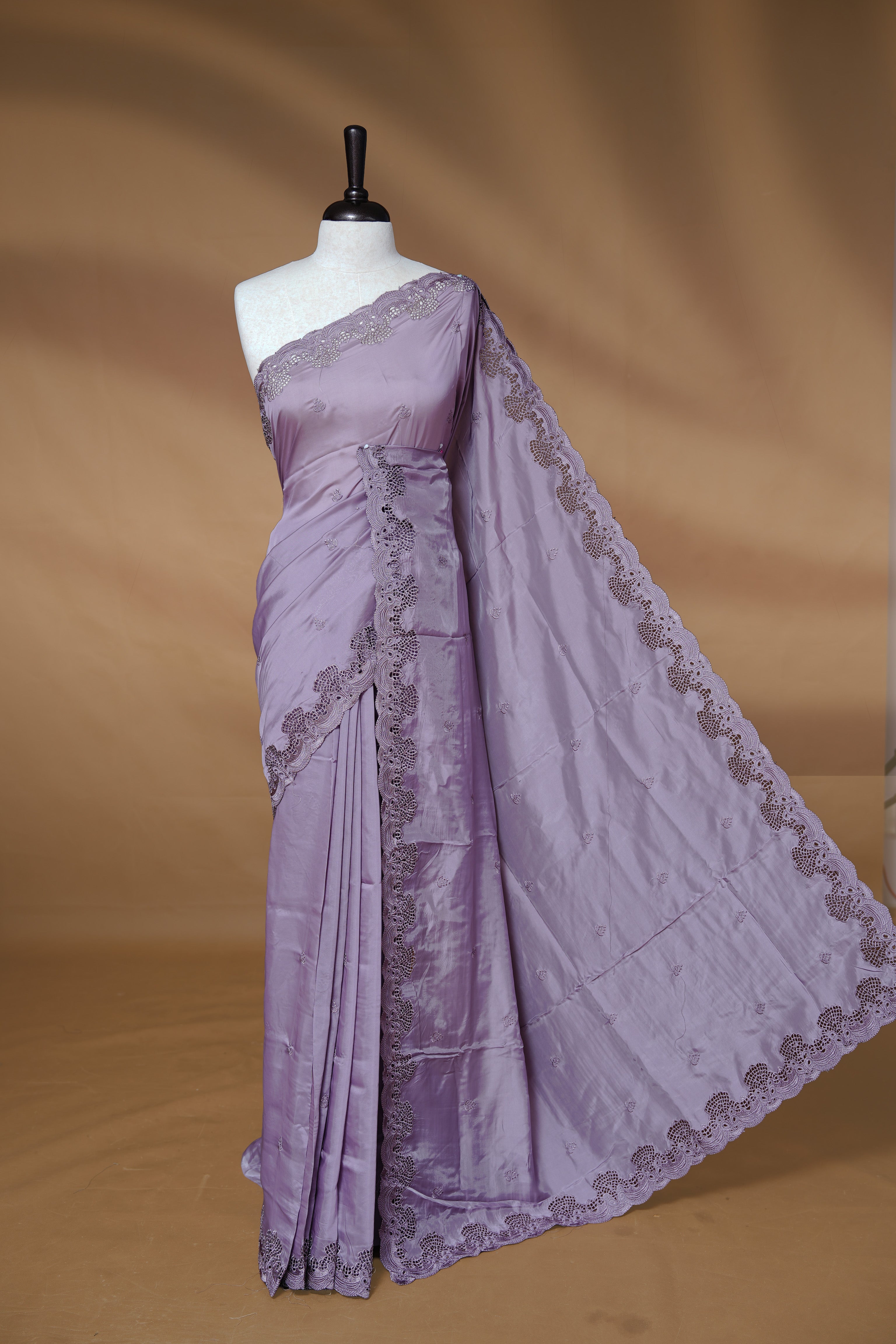 Pastel lavender colour Designer saree featuring Classic Plain body Styled with Thread motifs, Enrich with Thread & scalp border, paired with matching blouse piece.