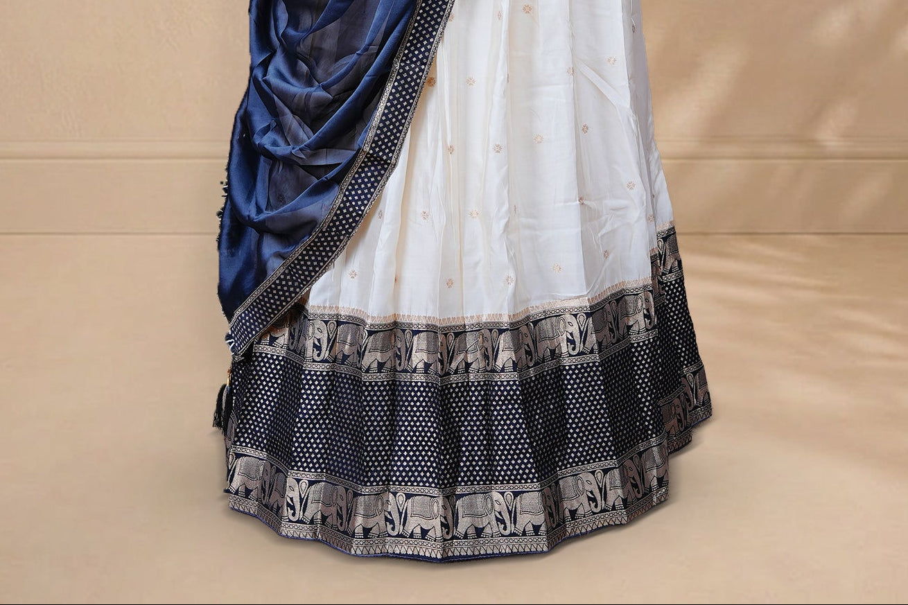Cream colour Half saree featuring Gold zari buttas on skirt with Zari border on contrast Black colour border, Unstitched Blouse and matching dupatta.