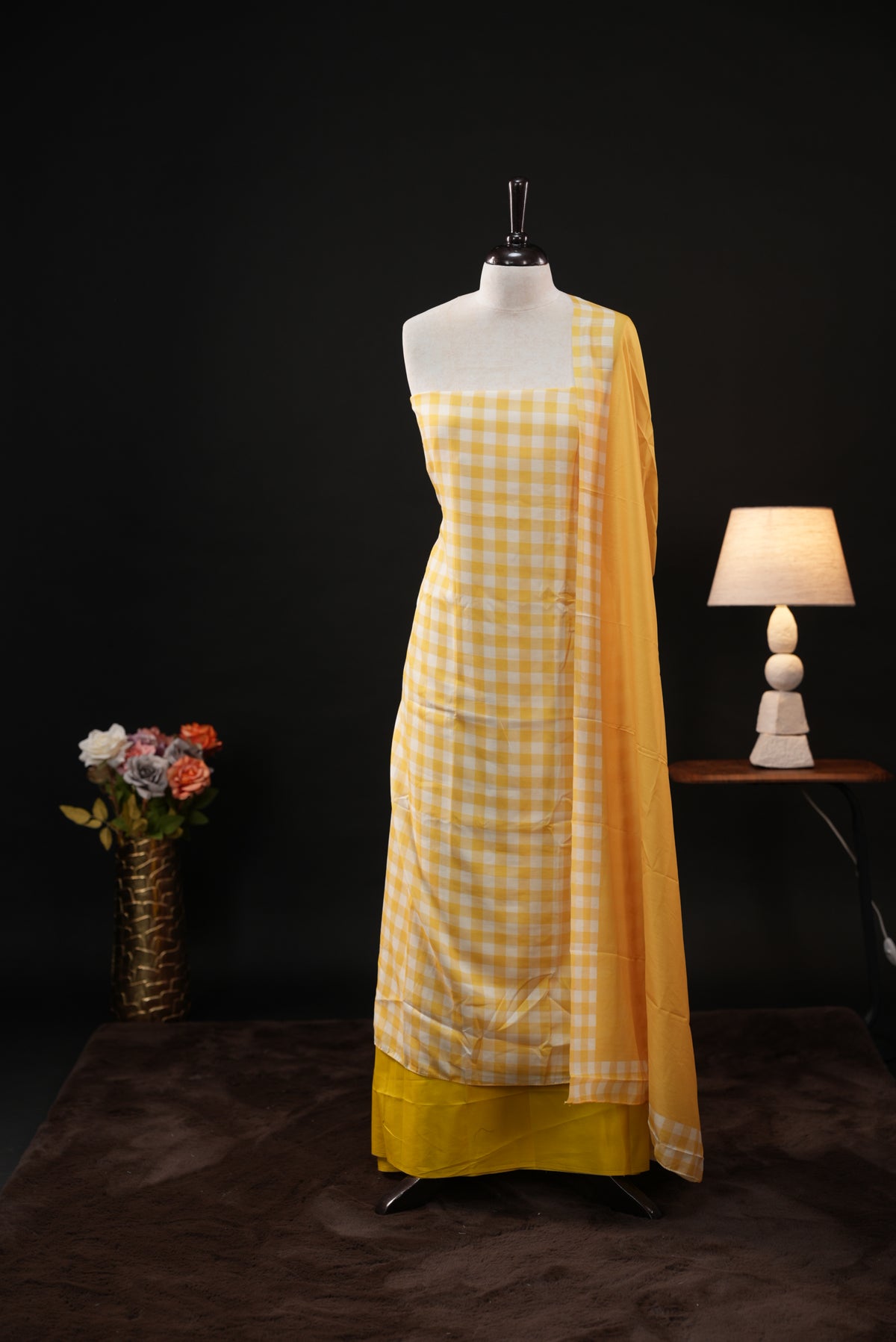 Yellow colour checked Mul Chanderi salwar material, paired with a matching bottom and dupatta.