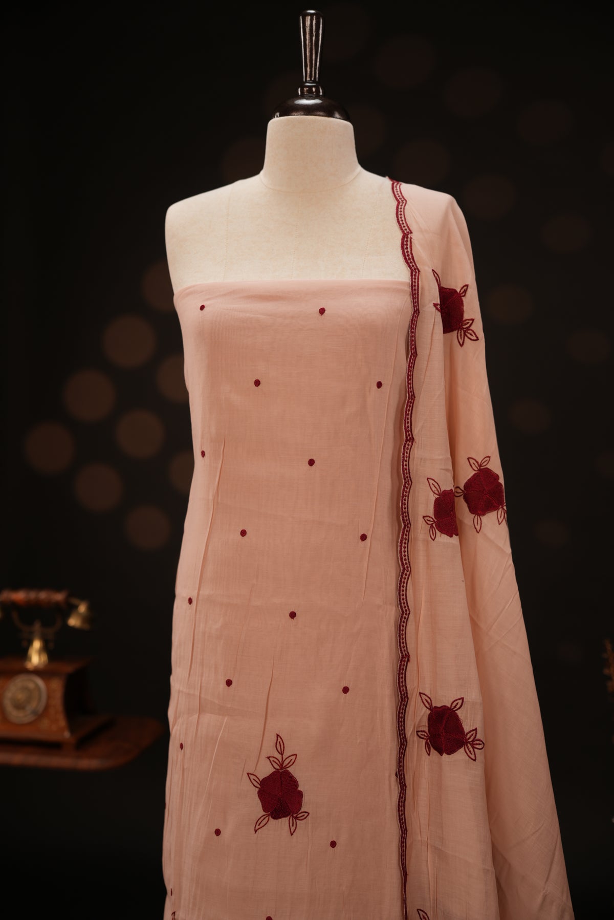 Peach colour mul chanderi salwar material featuring Floral & dot Thread embroidery body and border, paired with Same design with scallop border dupatta and santoon material bottom