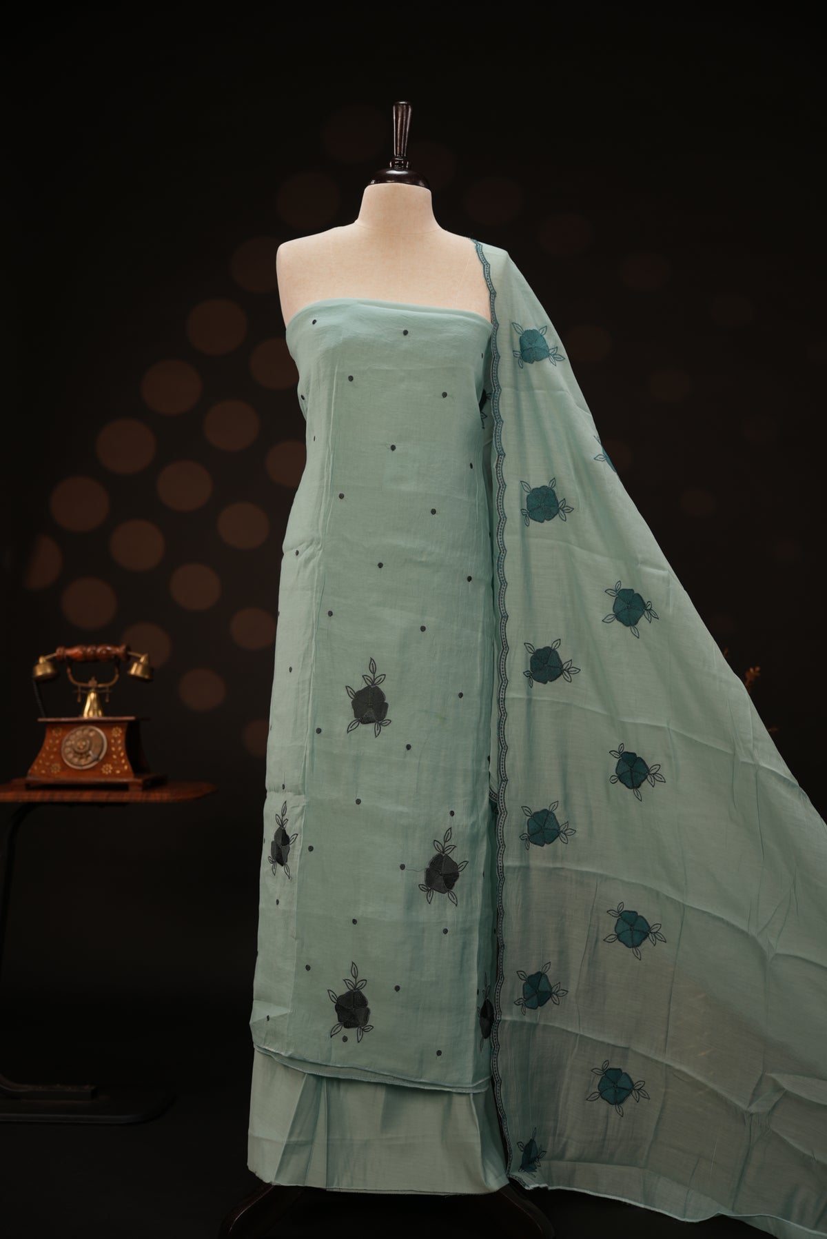 Pastel ice blue colour mul chanderi salwar material featuring Floral & dot Thread embroidery body and border, paired with Same design with scallop border dupatta and santoon material bottom