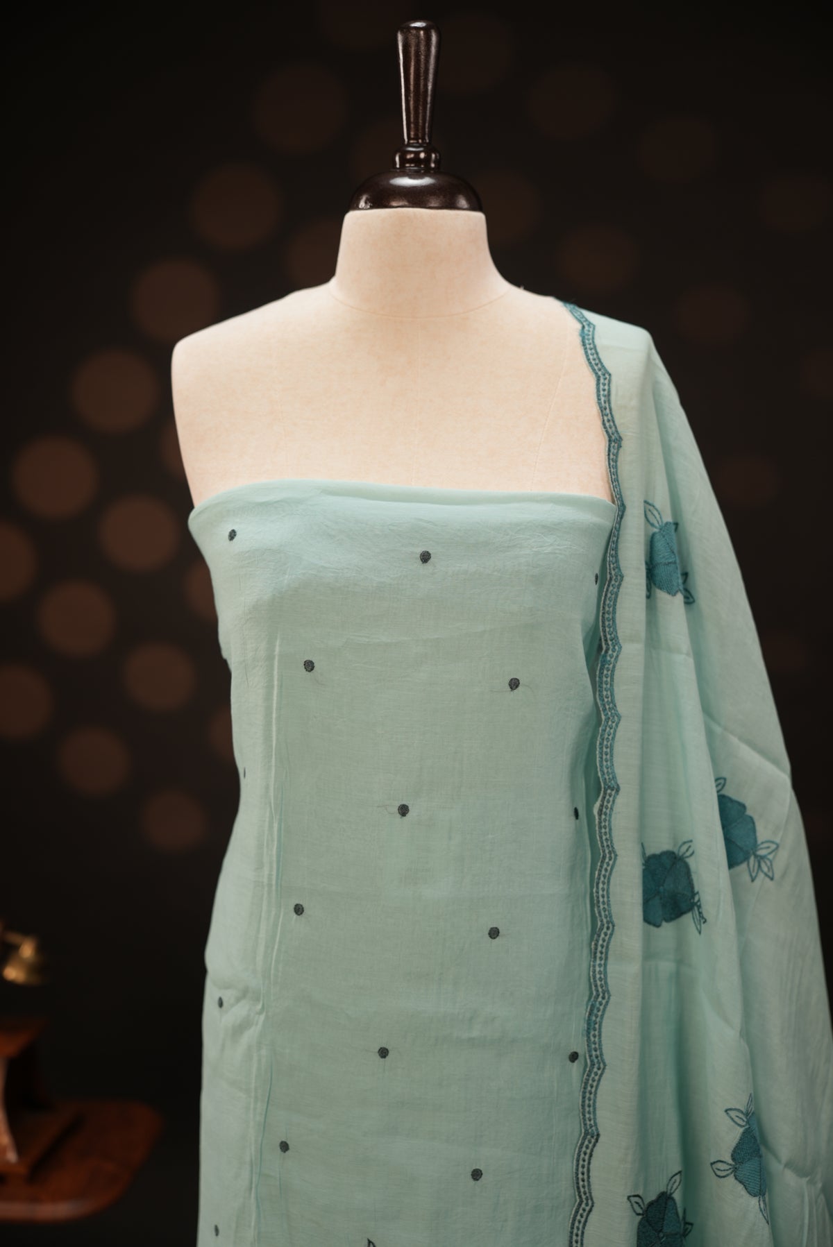Pastel ice blue colour mul chanderi salwar material featuring Floral & dot Thread embroidery body and border, paired with Same design with scallop border dupatta and santoon material bottom