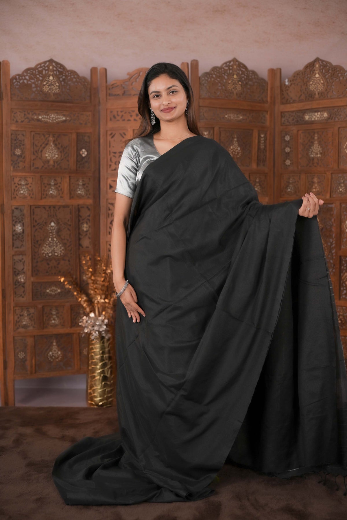 Black Colour Soft Cotton Saree featuring a plain body, complemented by a striped pallu with tissue detailing, paired with a matching blouse piece.