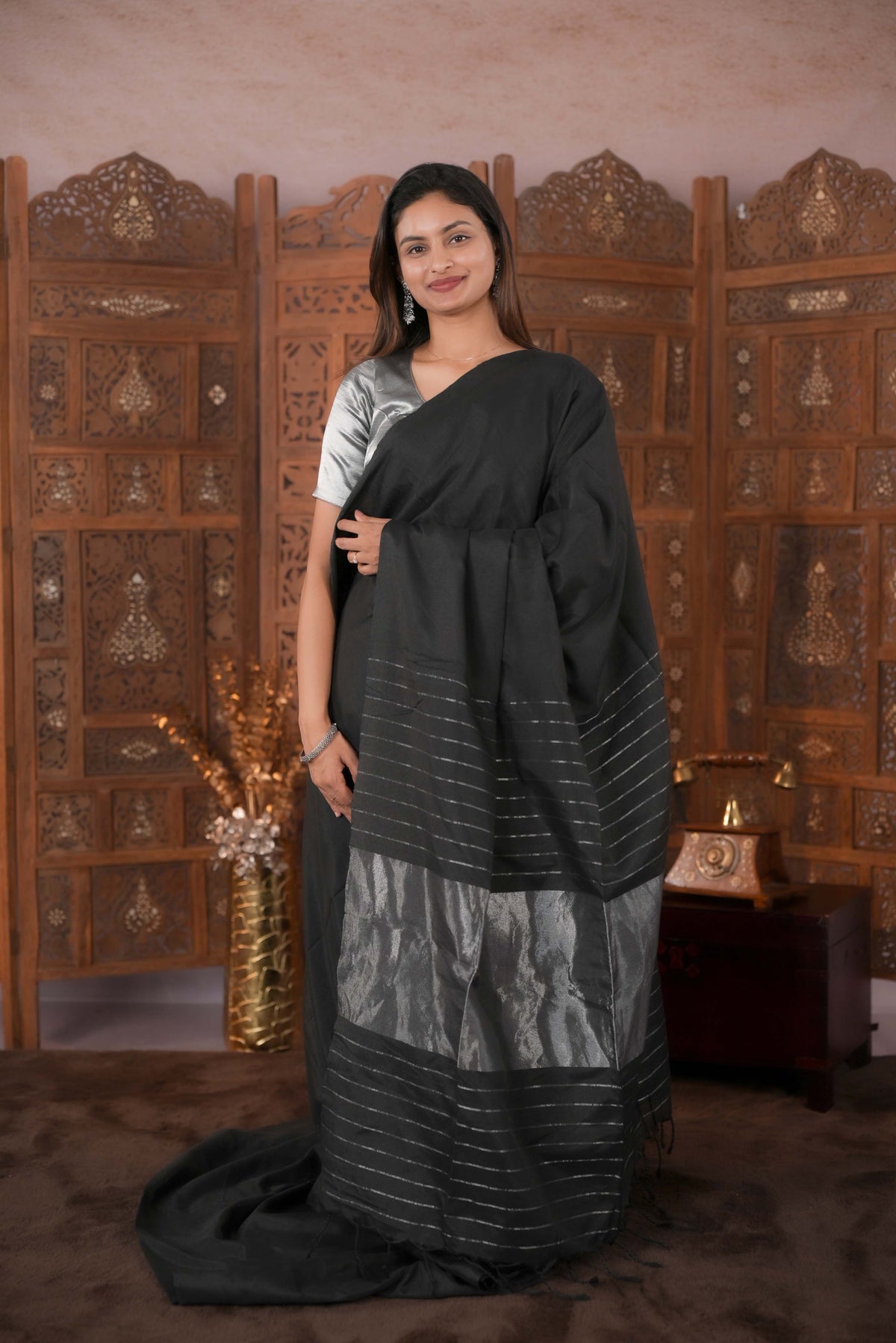 Black Colour Soft Cotton Saree featuring a plain body, complemented by a striped pallu with tissue detailing, paired with a matching blouse piece.