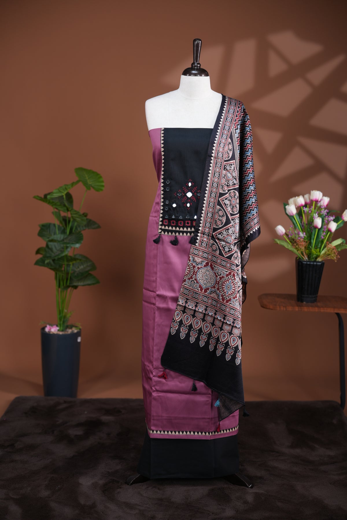 Onion Pink colour Jam Satin salwar material, Plain body with mirror & thread work on neck portion, matching bottom and Dupatta with ajrak print.