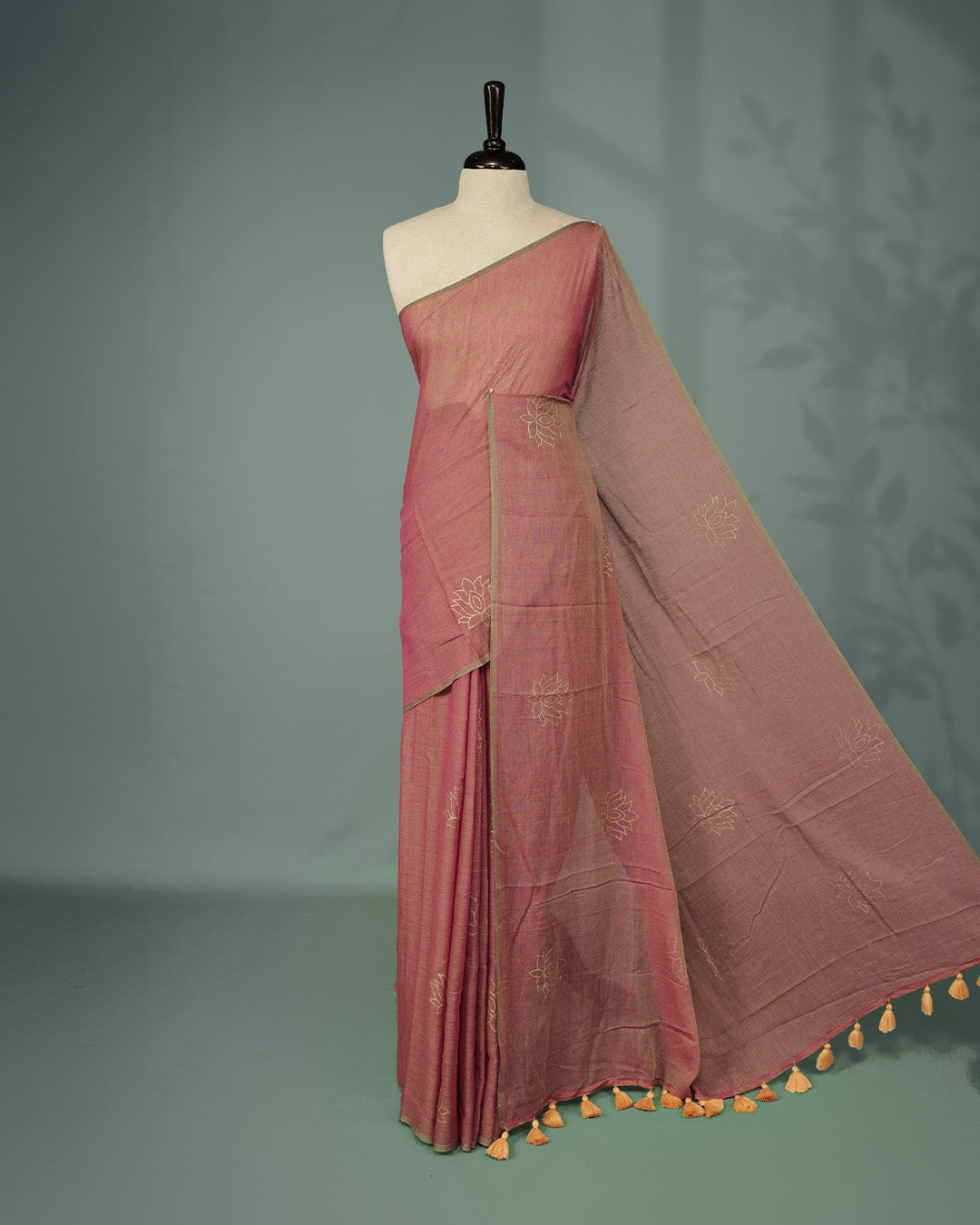 Green & Pink Dual tone colour pure mul cotton saree featuring Minimal Lotus Print on body, Clean Borderless design, elegant tassels.