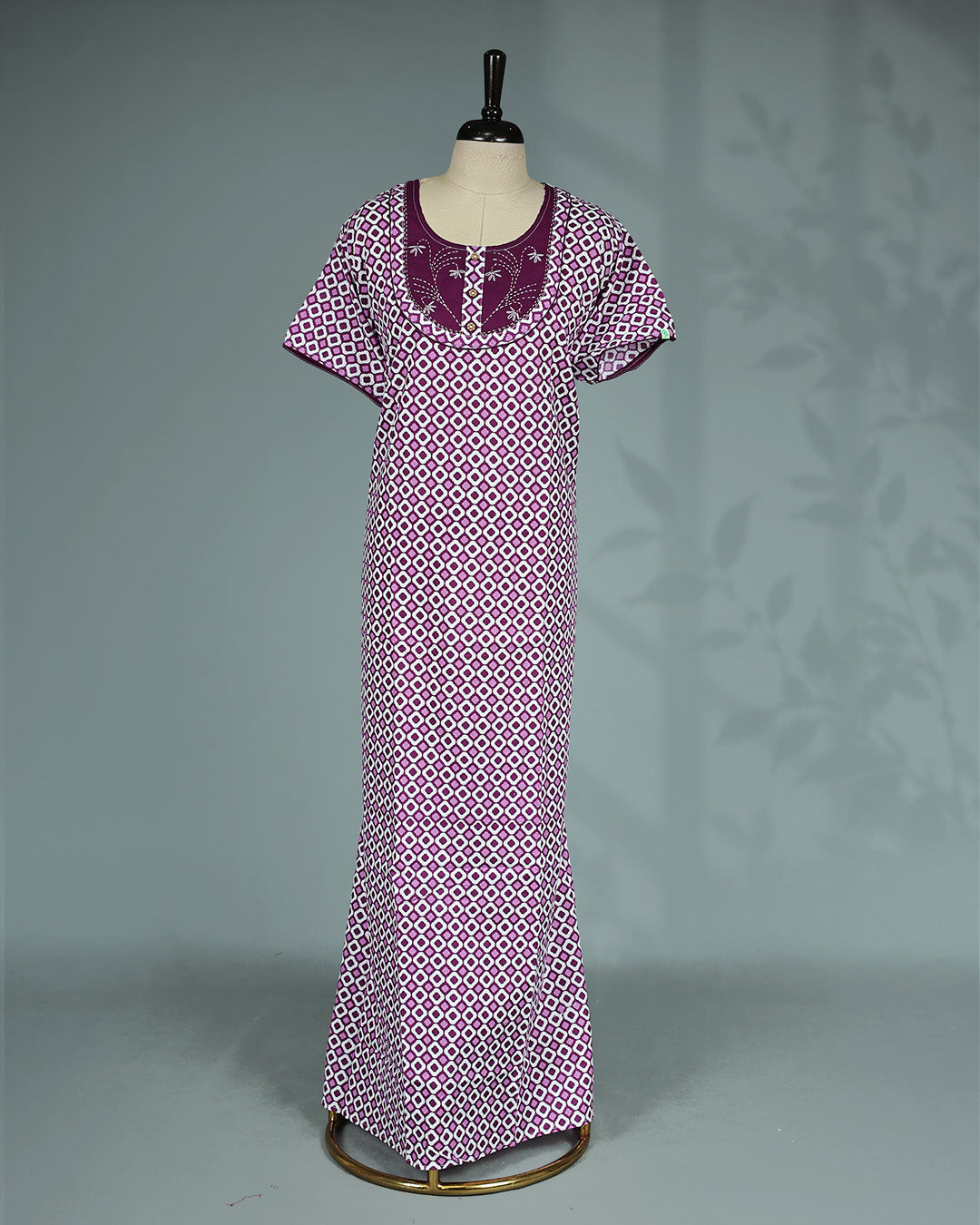 Purple and white geometric printed nighty with a classic scoop neckline, short sleeves, an embroidered contrast yoke with button detailing, and a relaxed full-length for everyday comfort and timeless style.