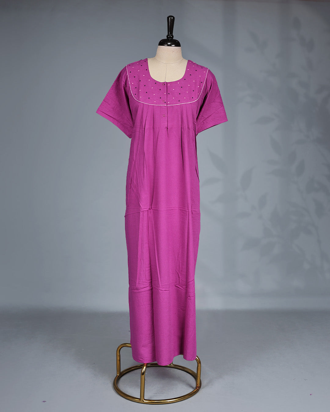 Purple colour nighty featuring a Tread work on yoke, an openable button-front Round neckline design, short sleeves & an ankle-length fit.