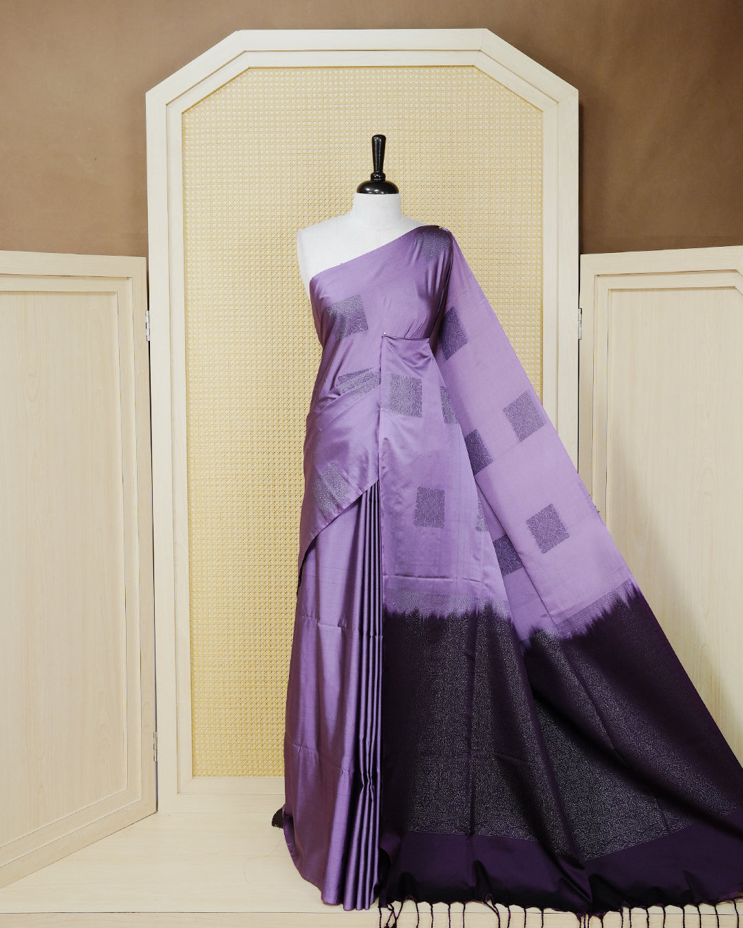 Lavender colour soft silk saree featuring antique zari motifs on body with contrast deep purple colour pallu & paired with matching blouse piece.