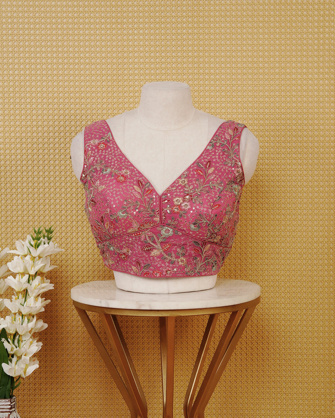 Pink colour Sleeveless Blouse Featuring A Stylish V-Neck, Intricate Floral Embroidery With Sequin Detailing, And A Comfortable Tailored Fit.