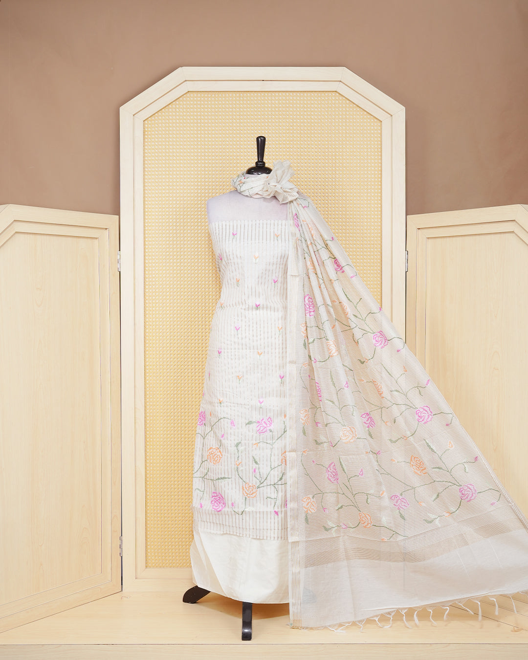 Cream colour tissue salwar material featuring beautiful floral embroidery design with elegant border, paired with matching bottom and beautiful dupatta.
