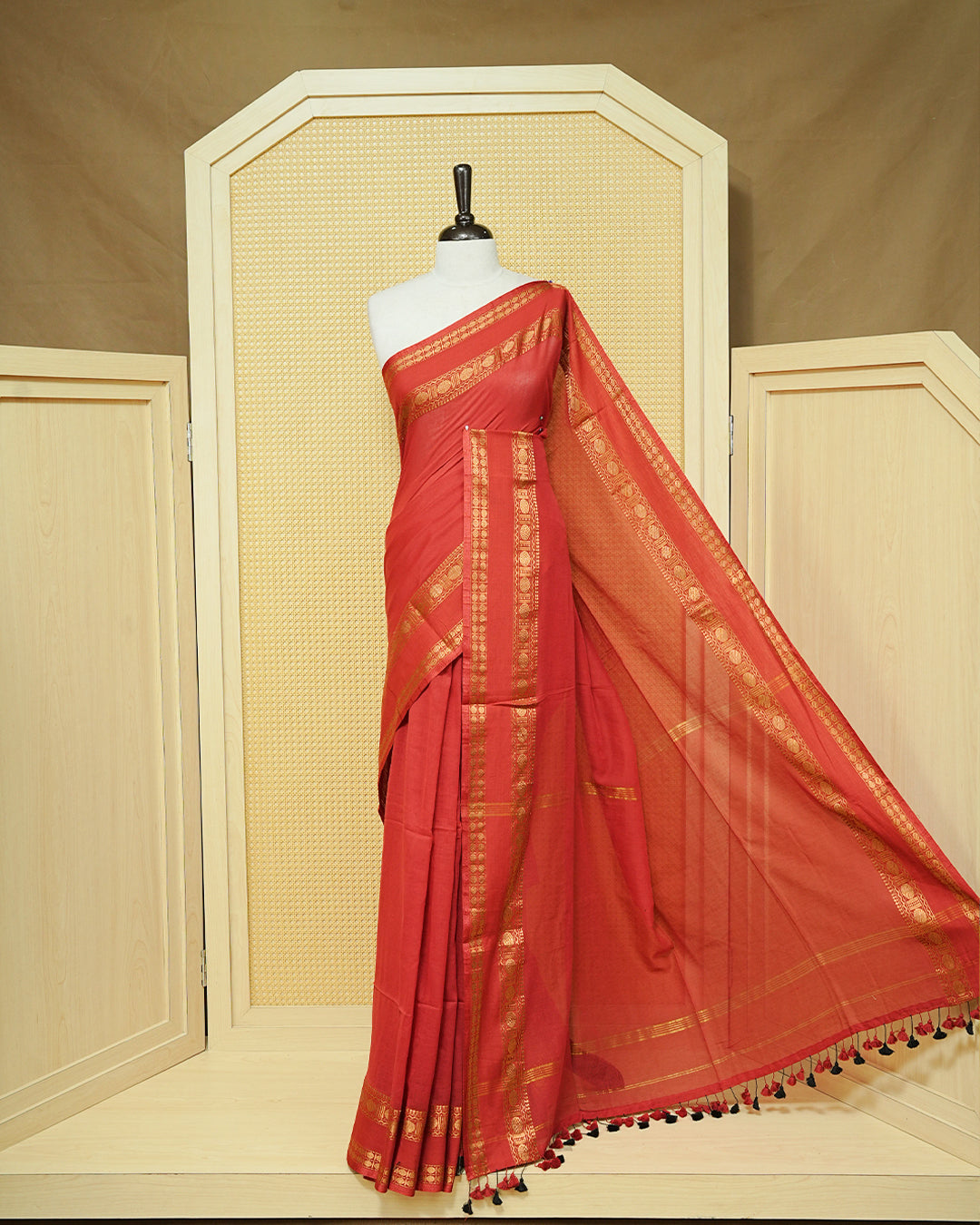Red colour Mul cotton saree featuring Elegant plain body, complemented by Self colour Gold zari border & tassels.