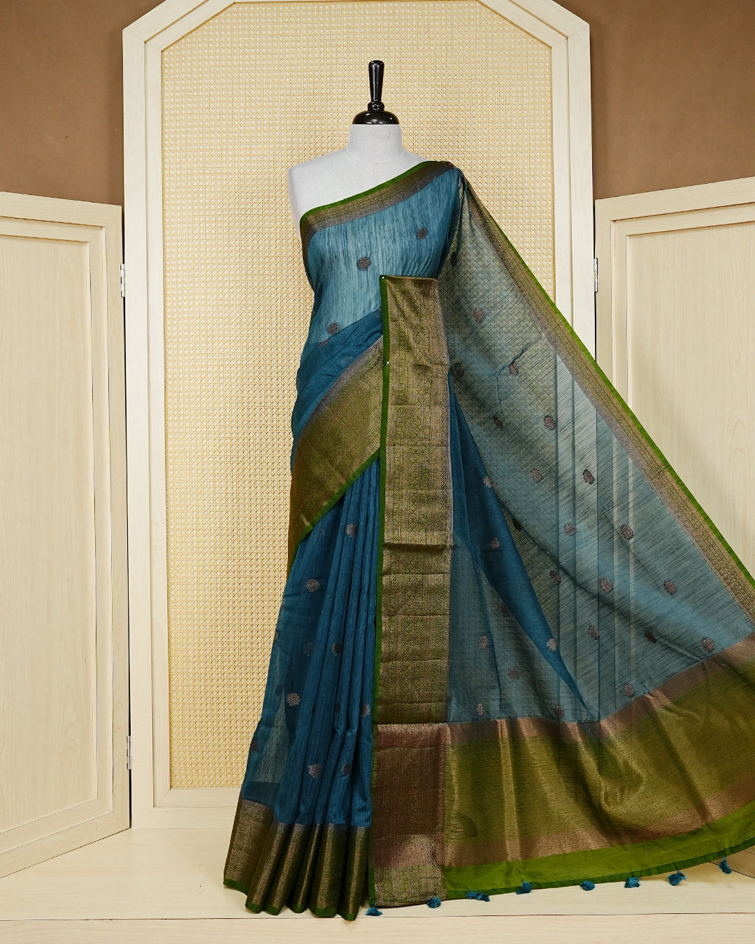Peacock blue colour semi linen saree thread motifs on body, contrast mehndi green colour gold zari border, rich pallu comes with matching blouse piece