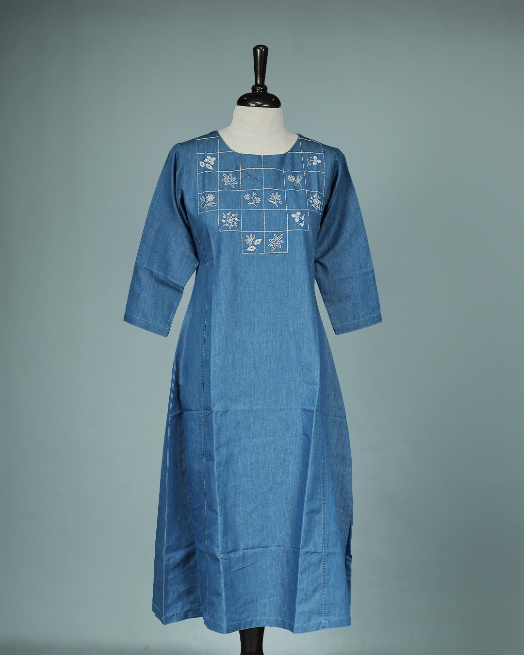 Light Blue Denim Design Colour Kurti featuring Thread Box with Floral motifs Work On body , a U neckline, With sleeve.